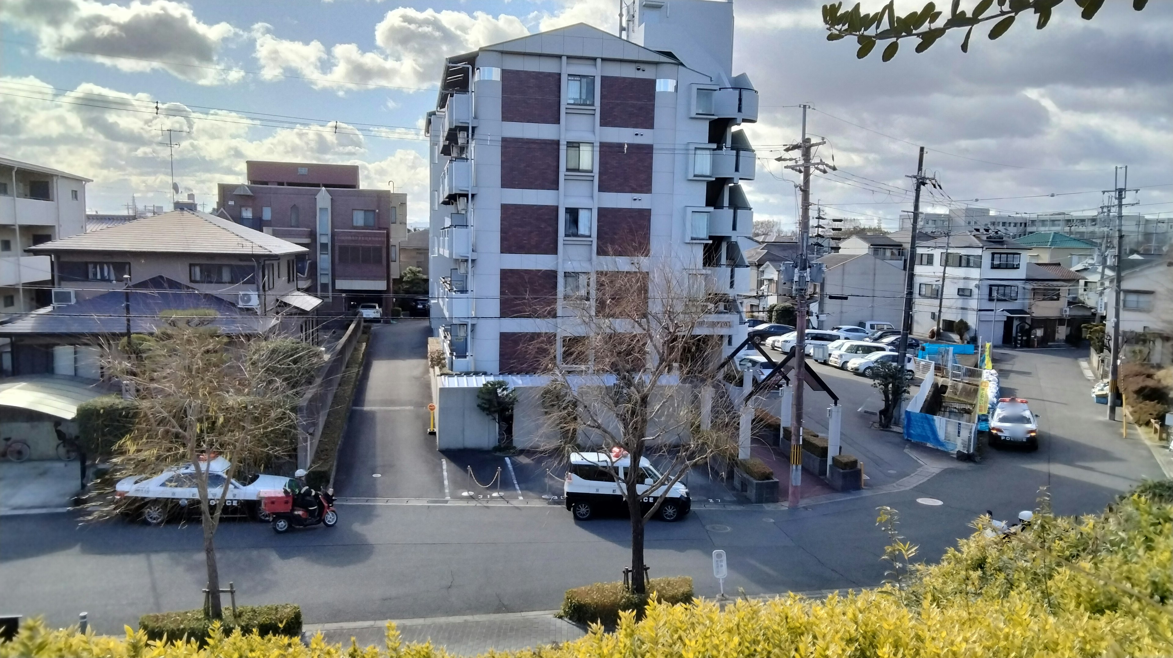 Apartment building in a residential area with parking lot