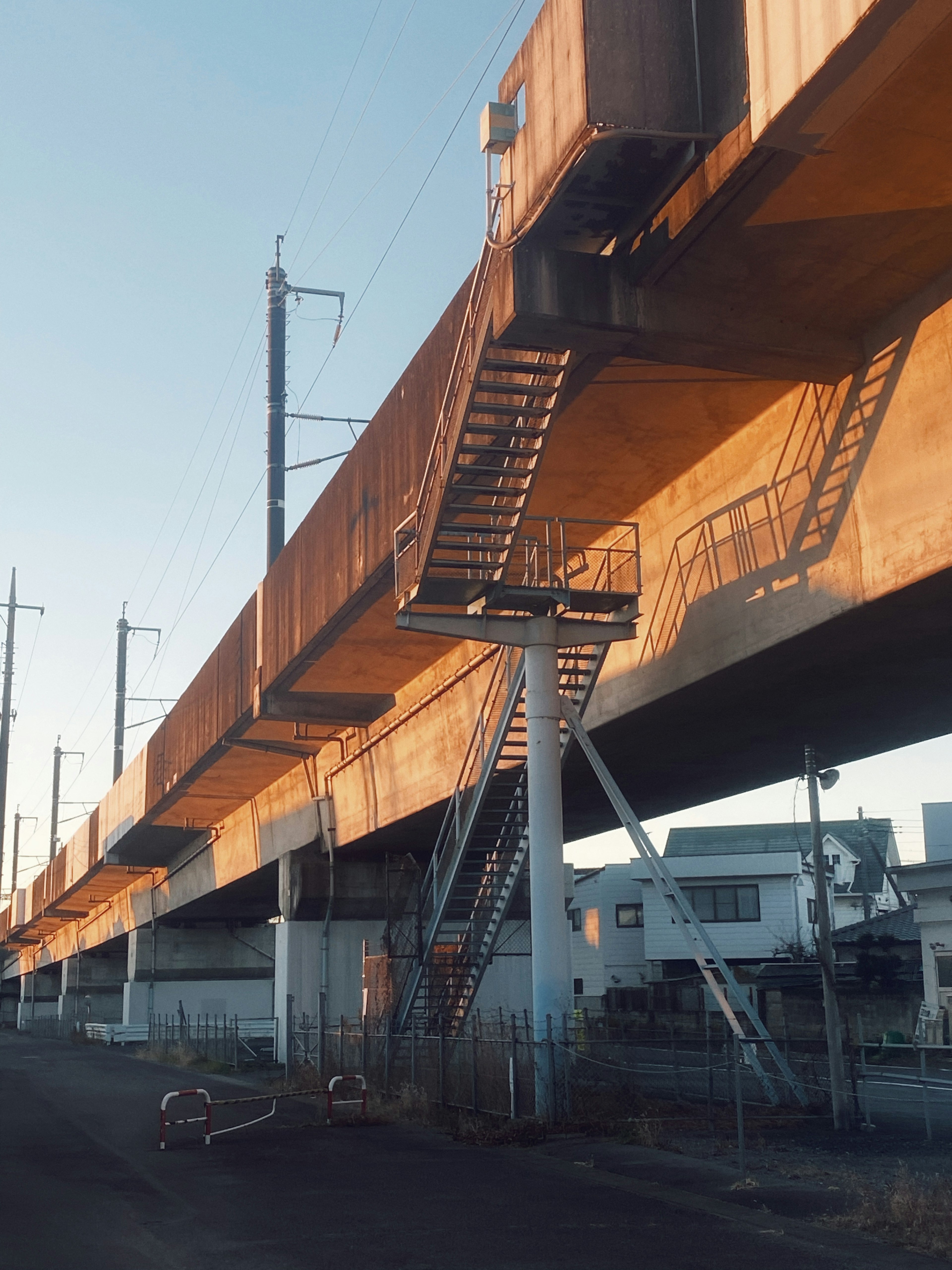 Metal staircase and support structure of an elevated bridge