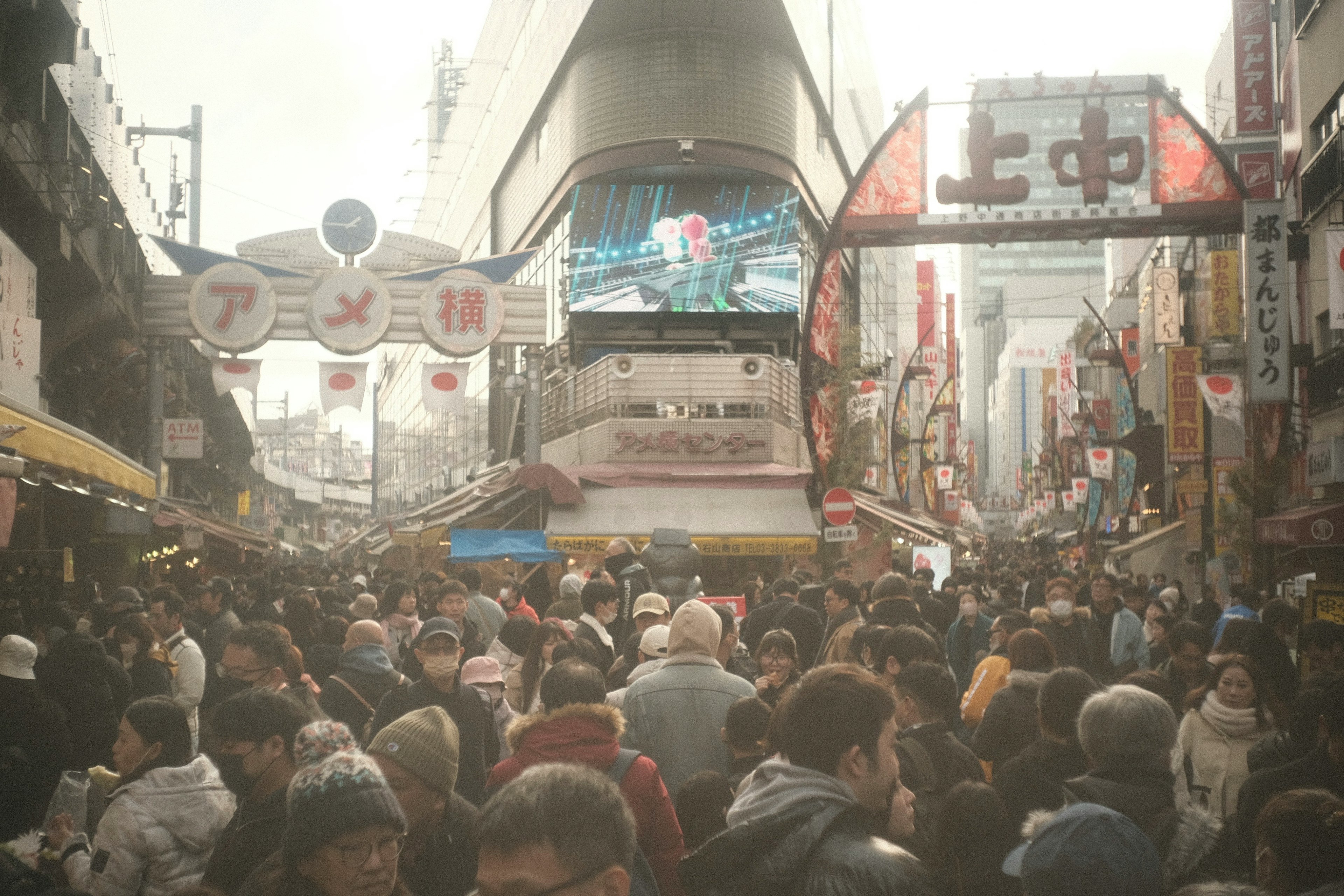 Crowded street in a vibrant shopping district filled with many people