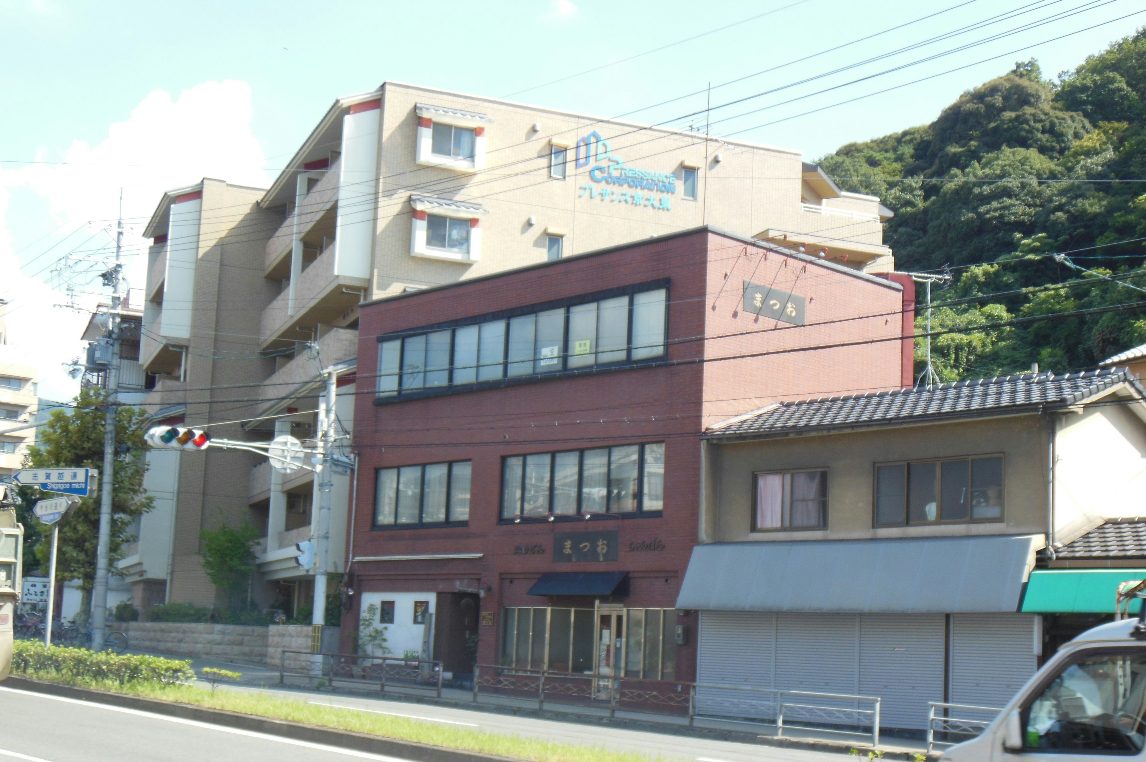 A red brick building with surrounding residential area