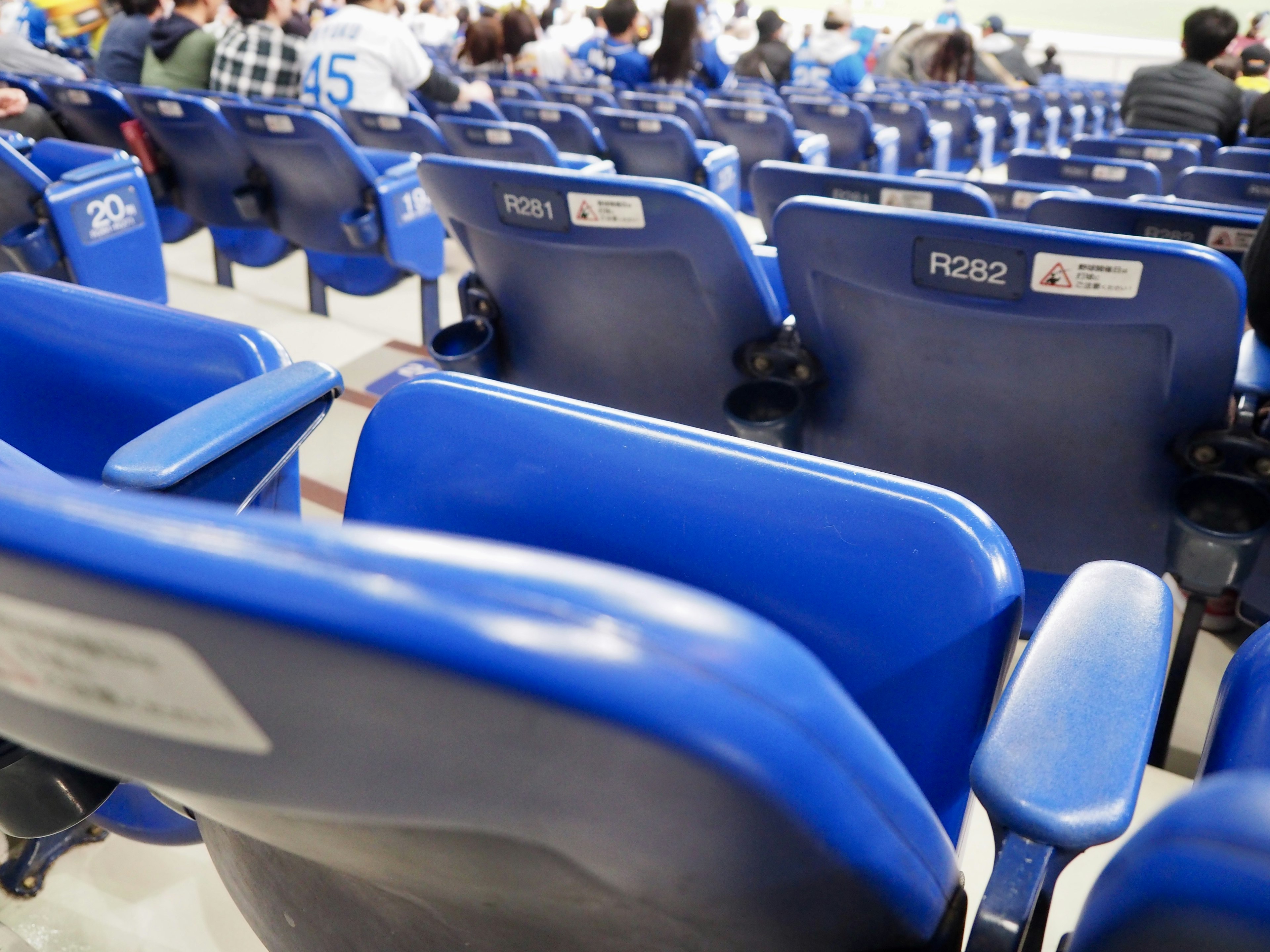 Blue stadium seats arranged in rows