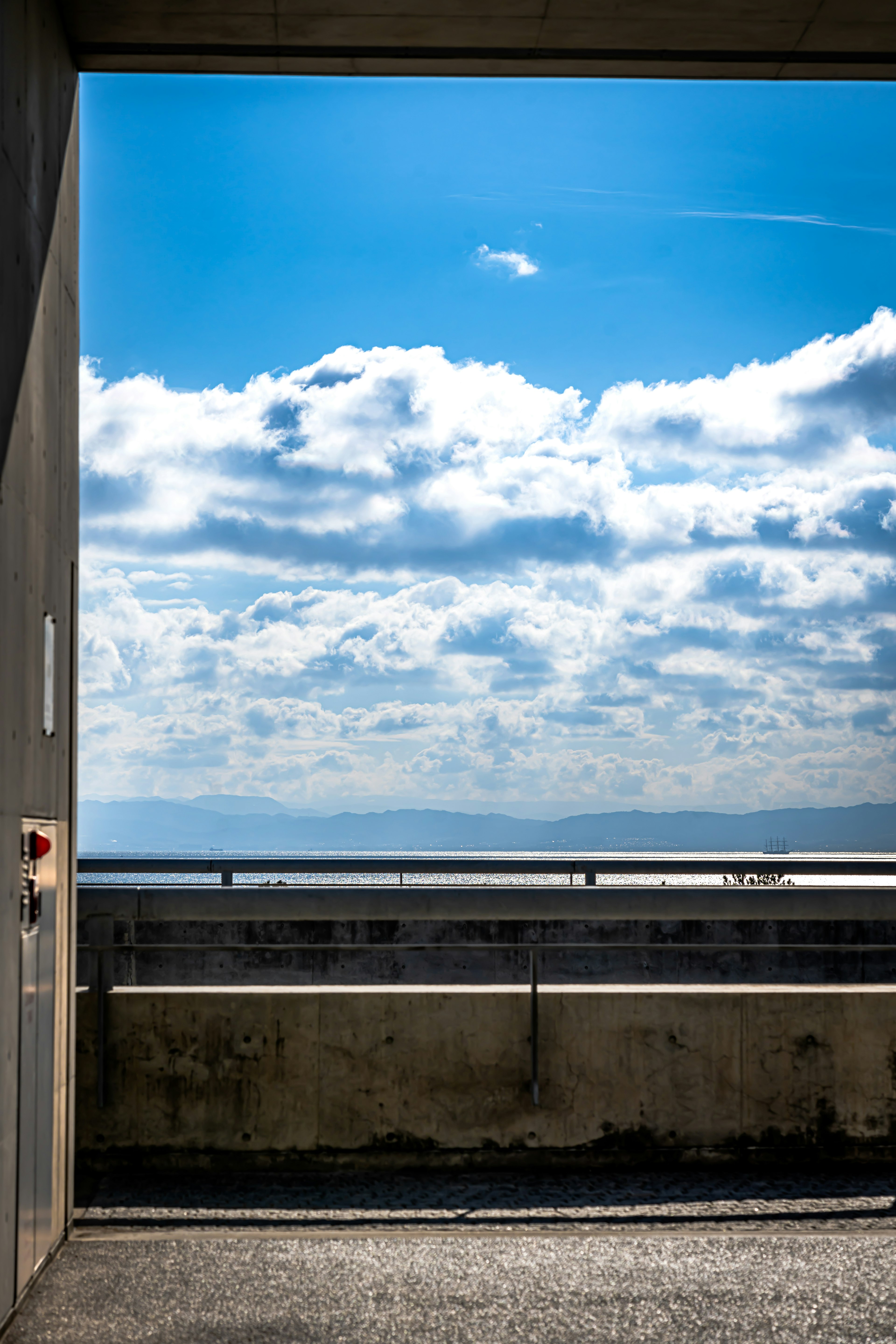 View of blue sky and clouds through an open doorway