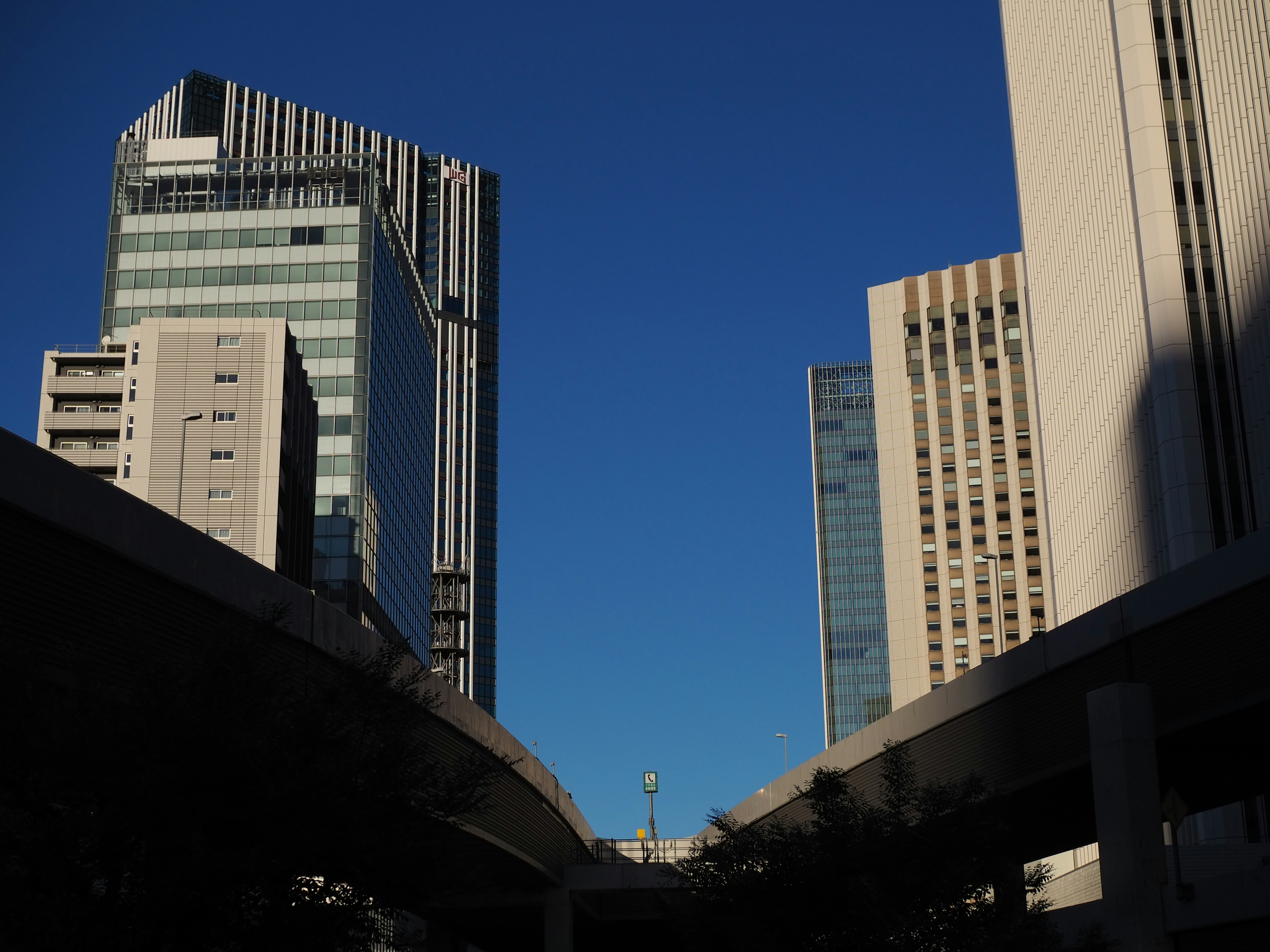 Urban landscape with skyscrapers under a clear blue sky