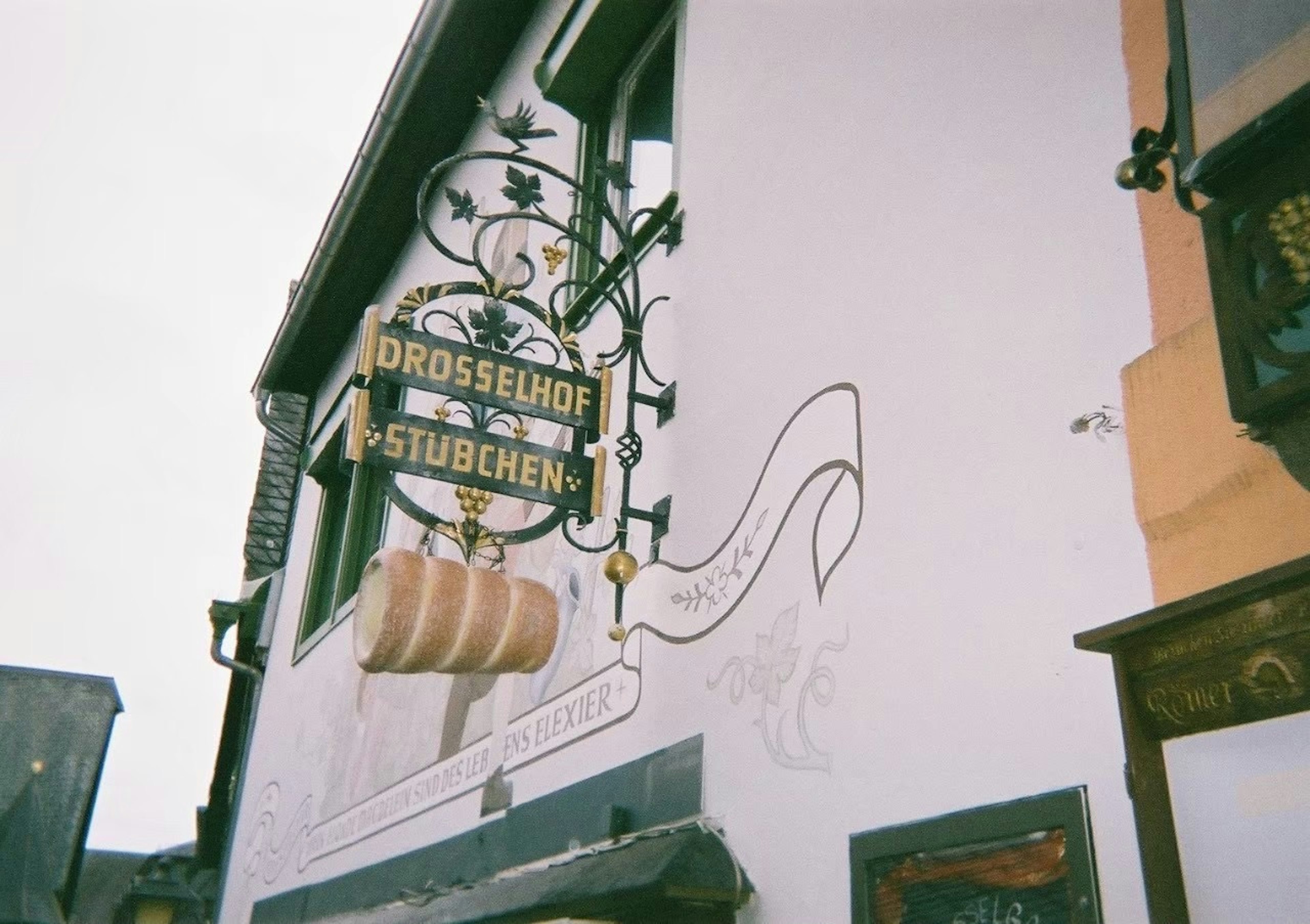 Exterior of a German inn with a traditional sign