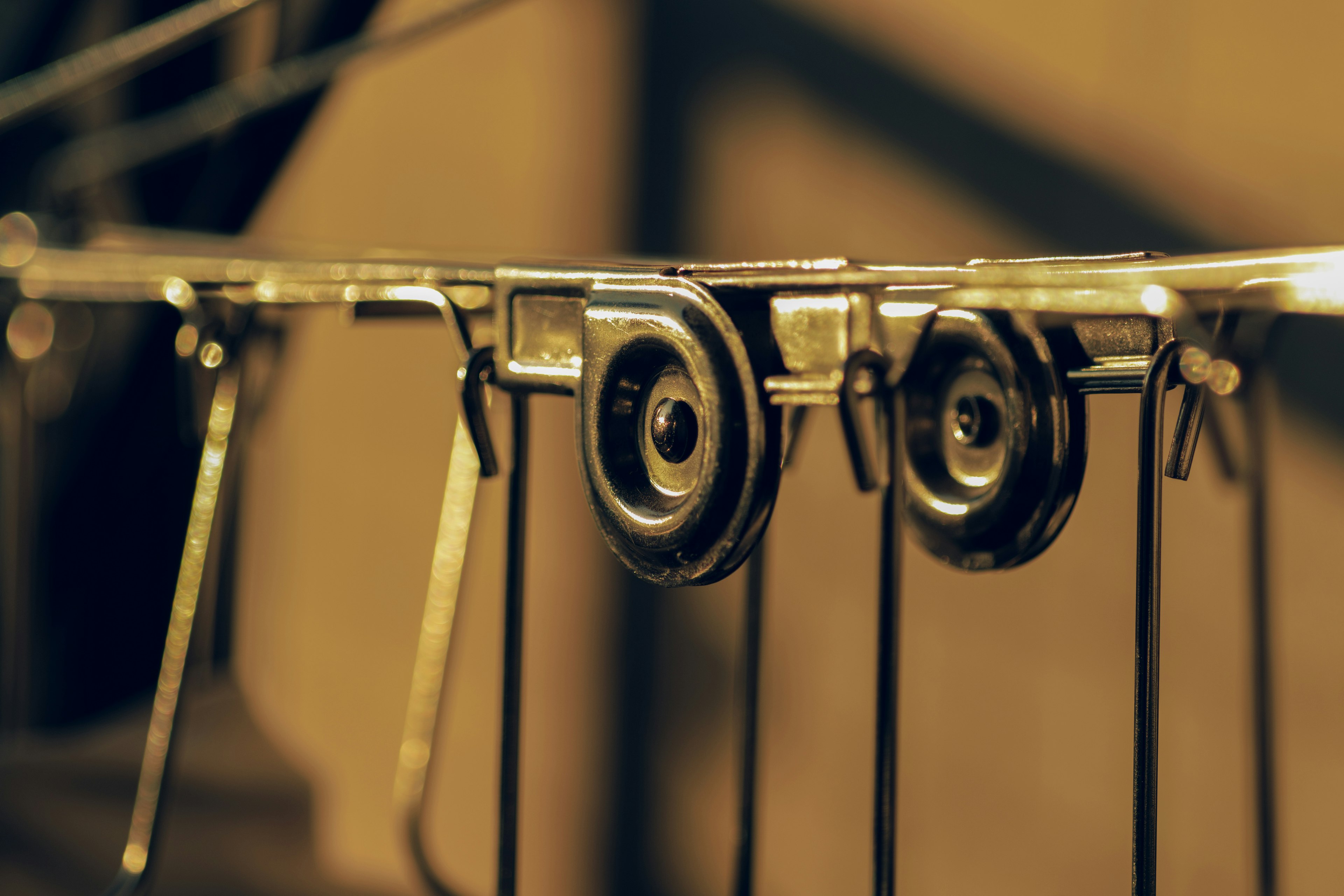 Close-up image of metal pulleys arranged in a row