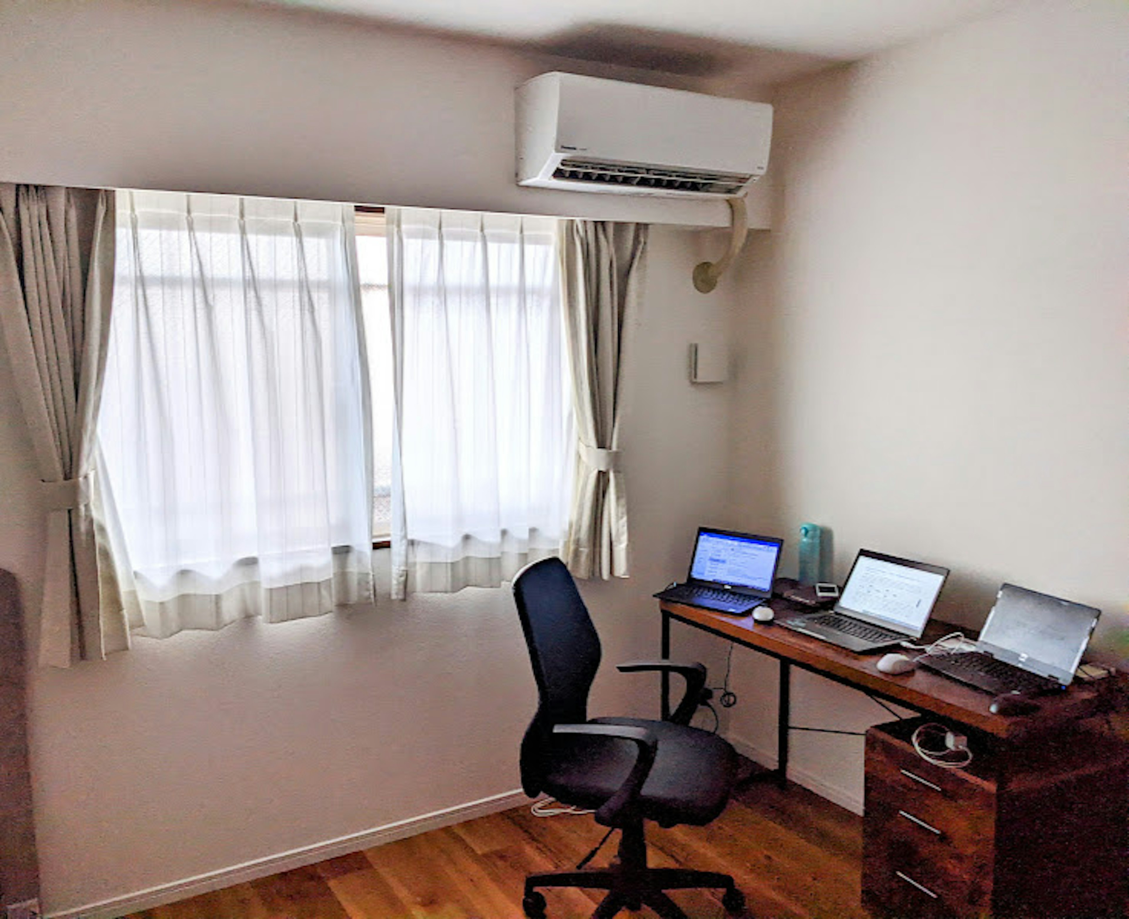 Bright room featuring a desk and chair with natural light coming through the window