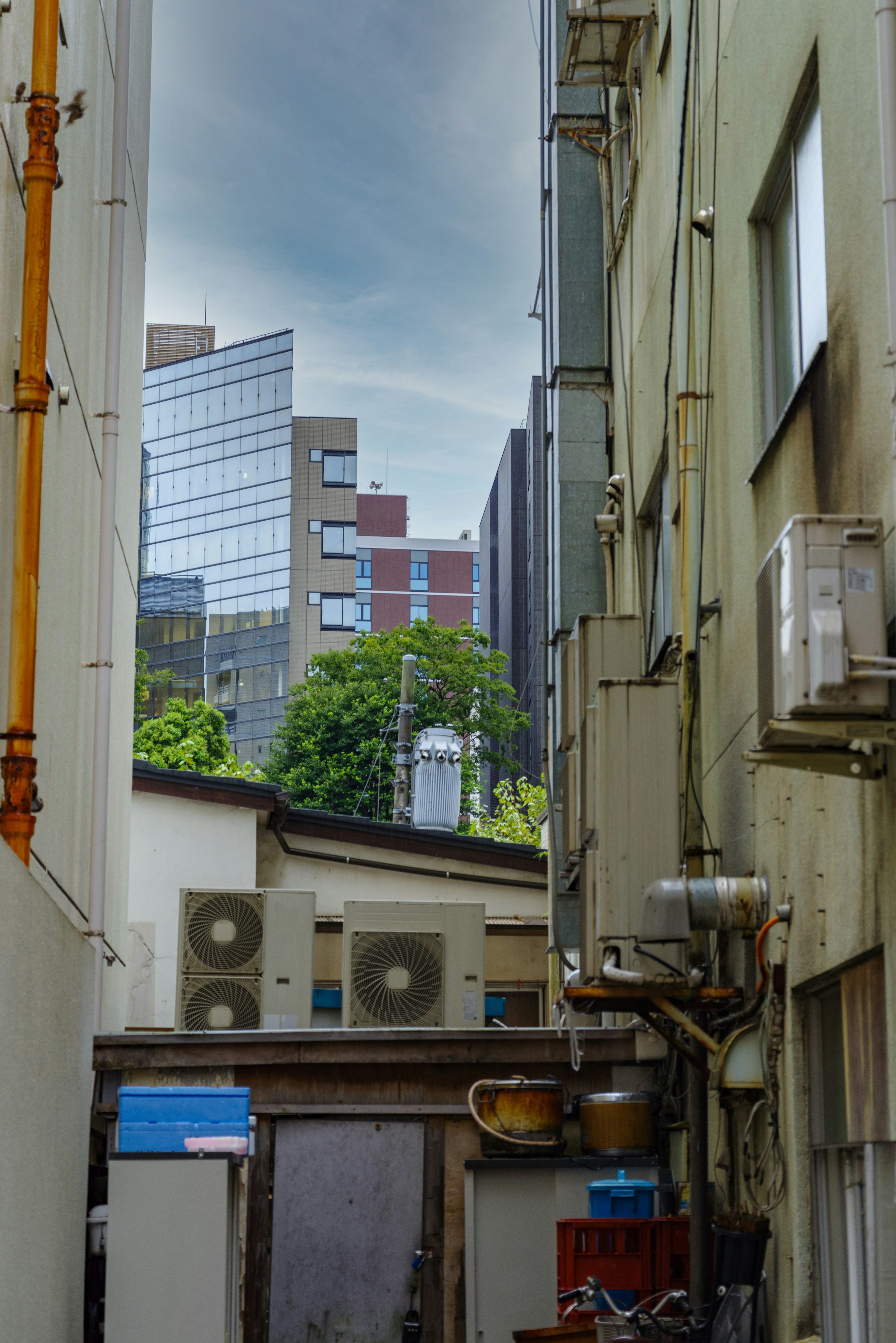 Urban alley showcasing buildings and high-rise structures