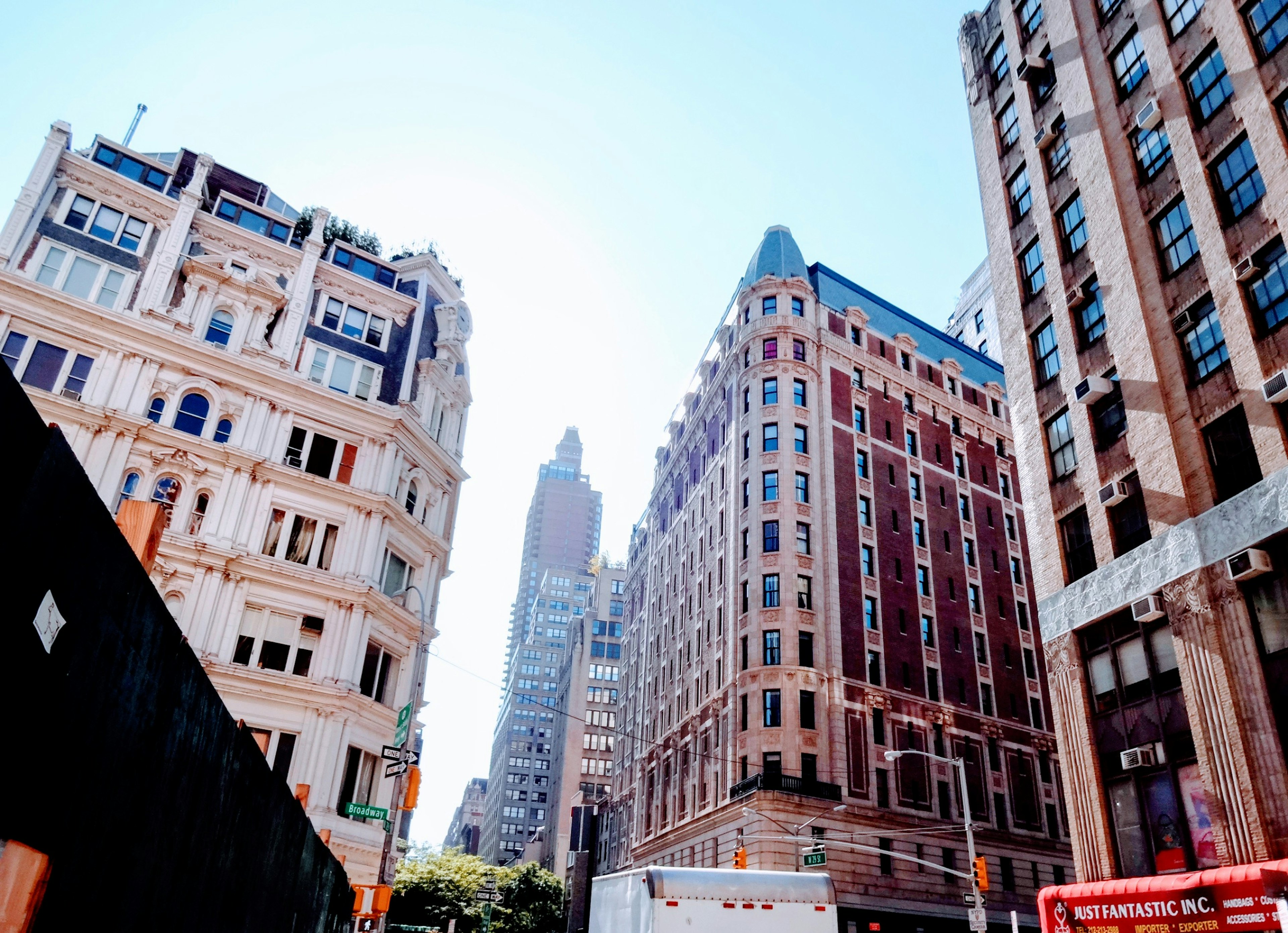 Urban skyline with tall buildings bright sky and sunlight