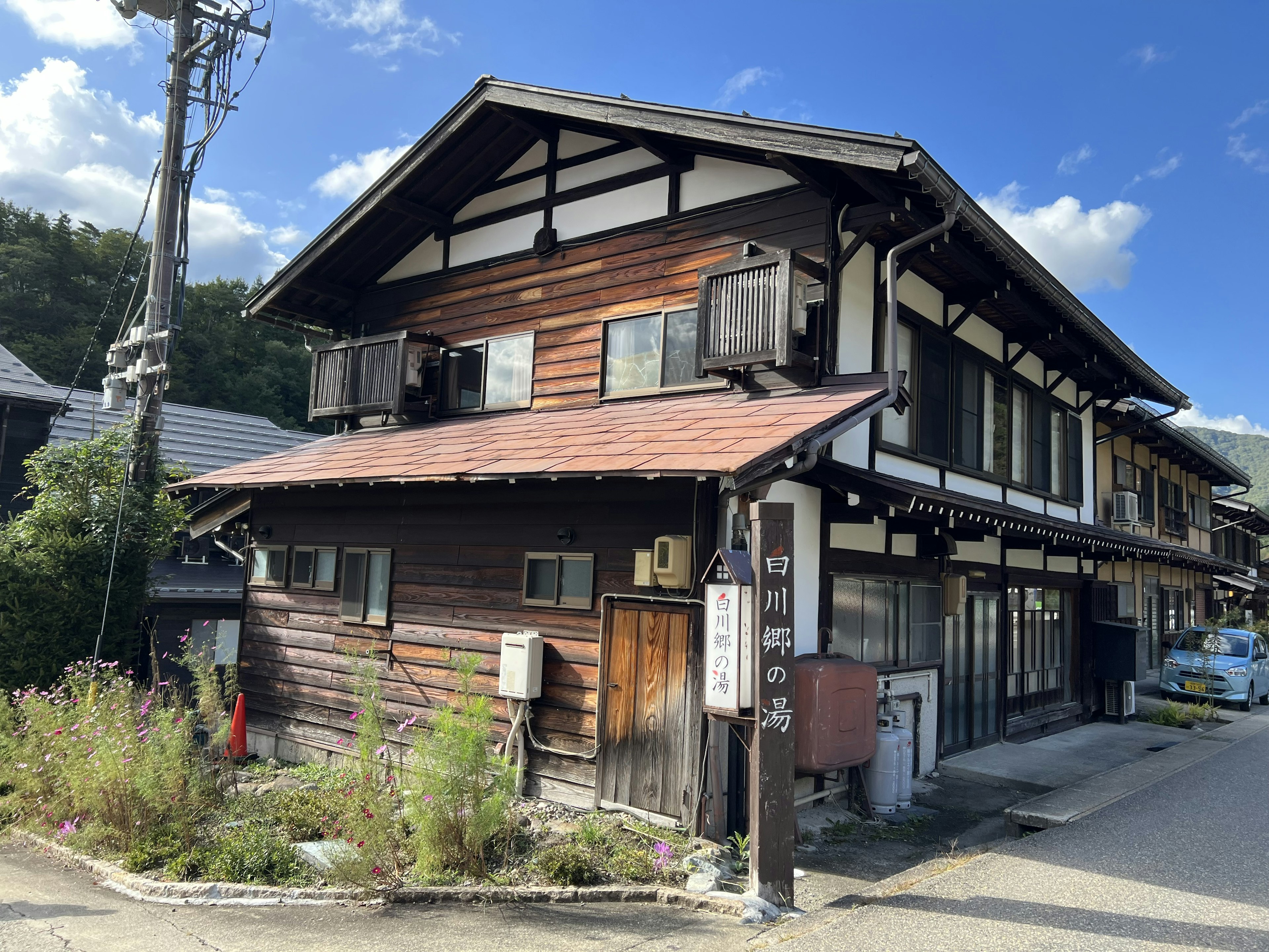 Traditional Japanese wooden building with a bright sky