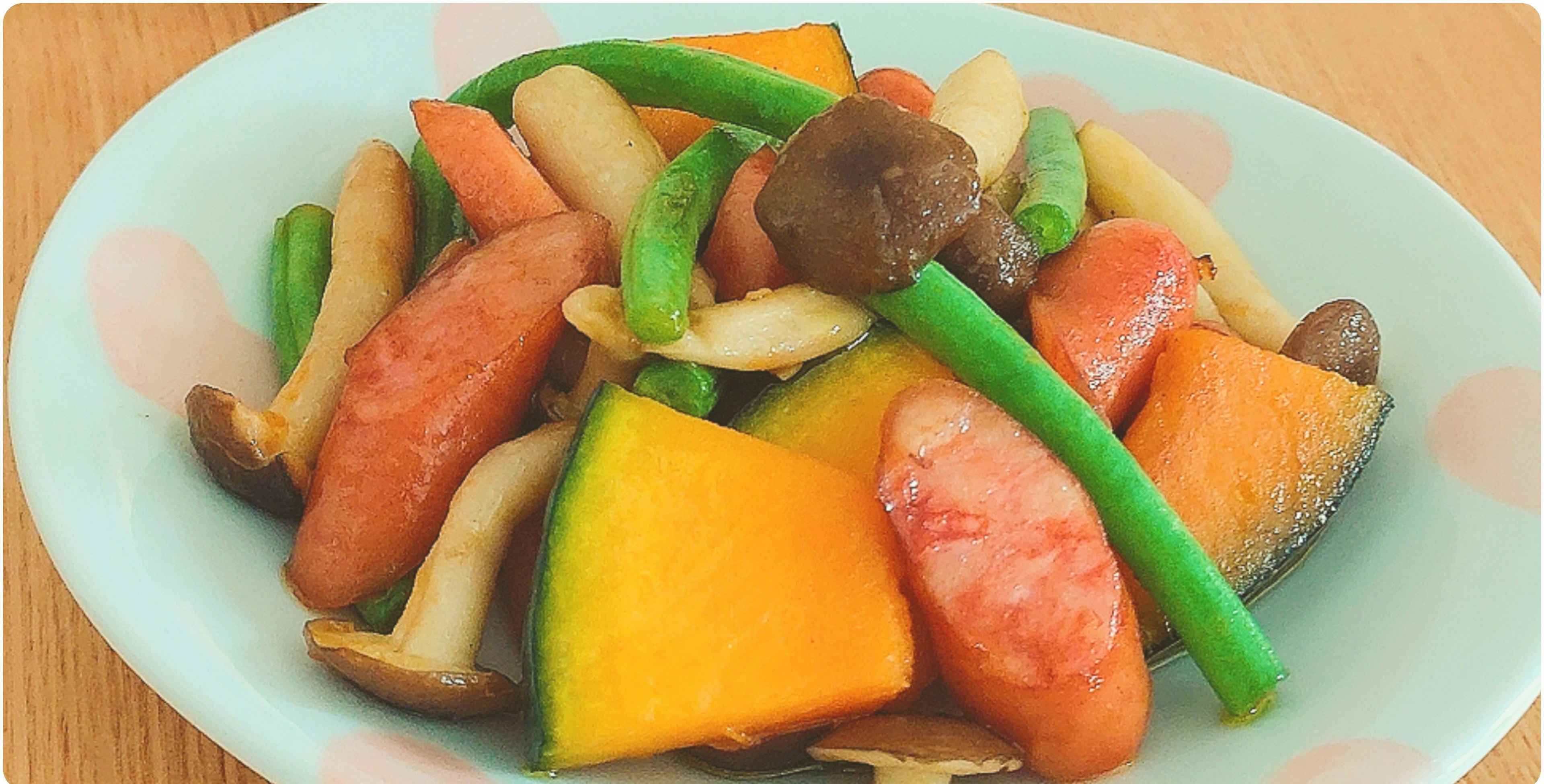 Colorful salad with various vegetables including green beans and mushrooms