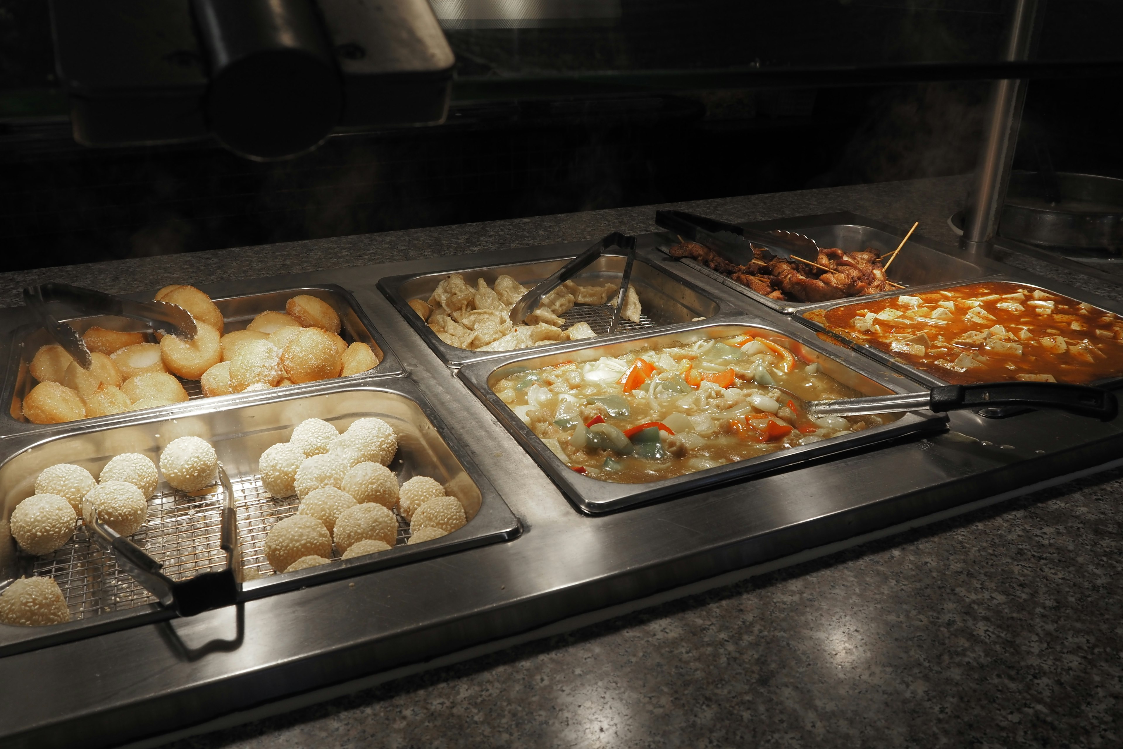 Buffet style food displayed on a counter