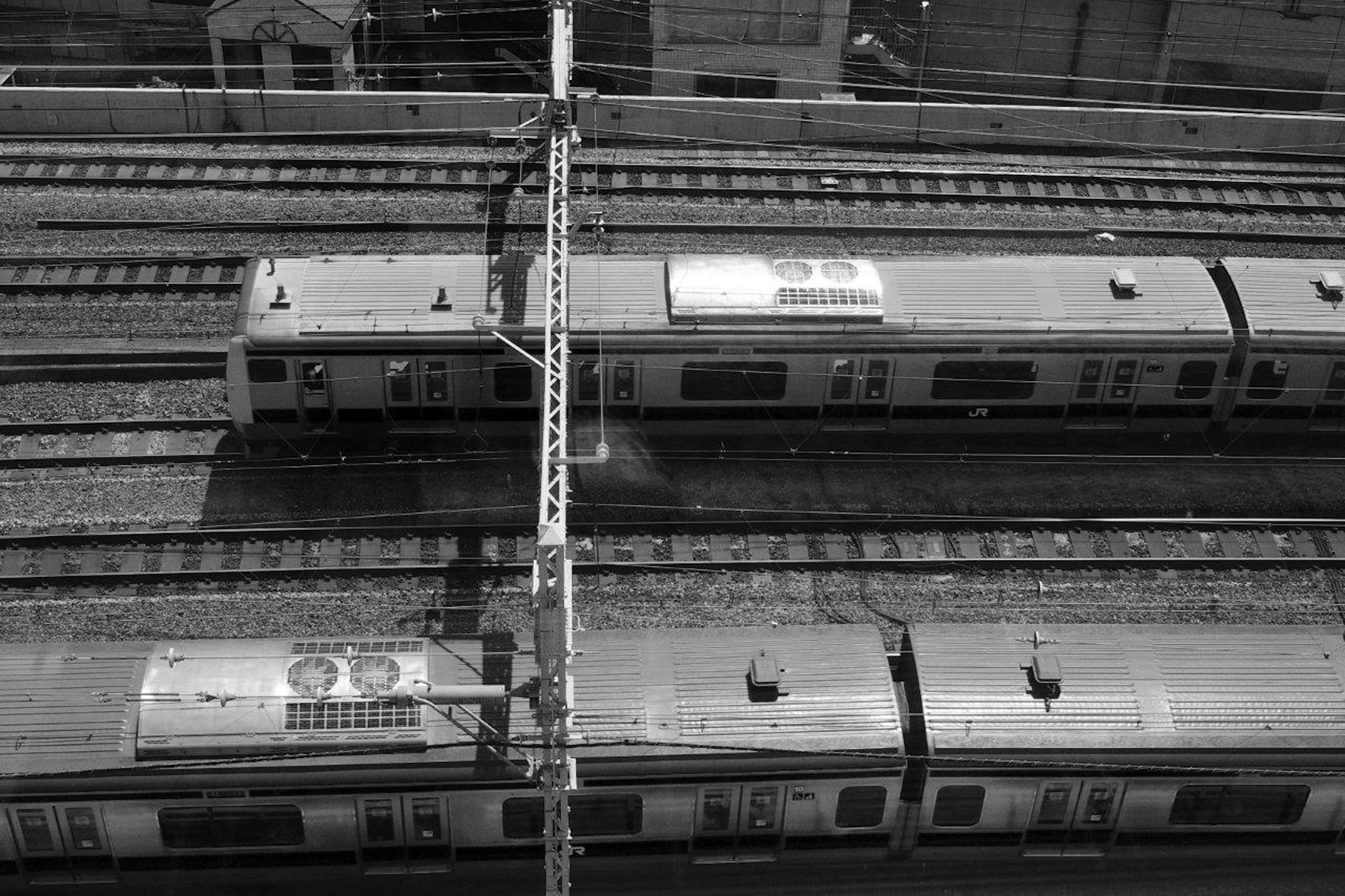 Aerial view of train cars on railway tracks