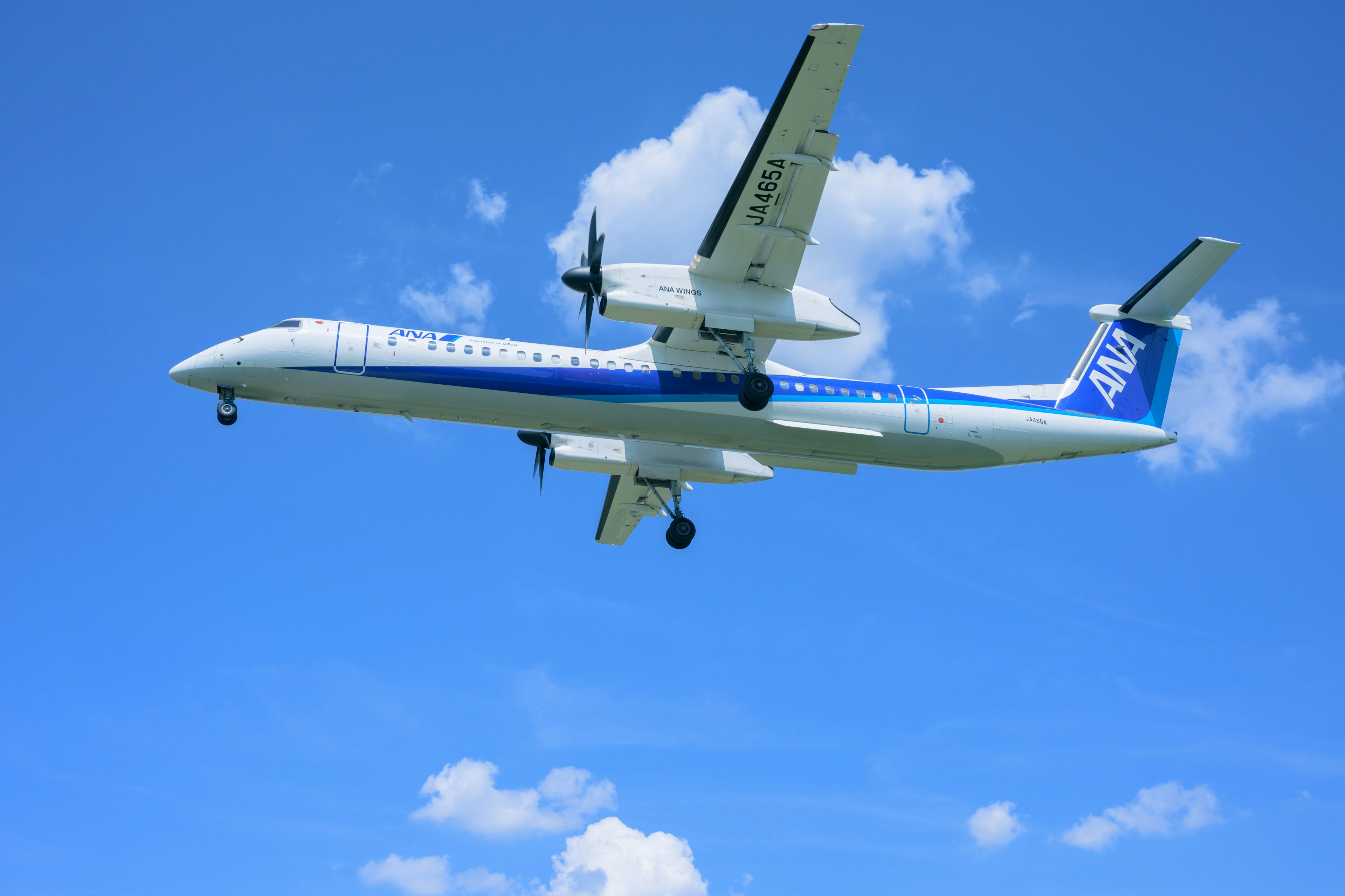 Airplane taking off against a blue sky