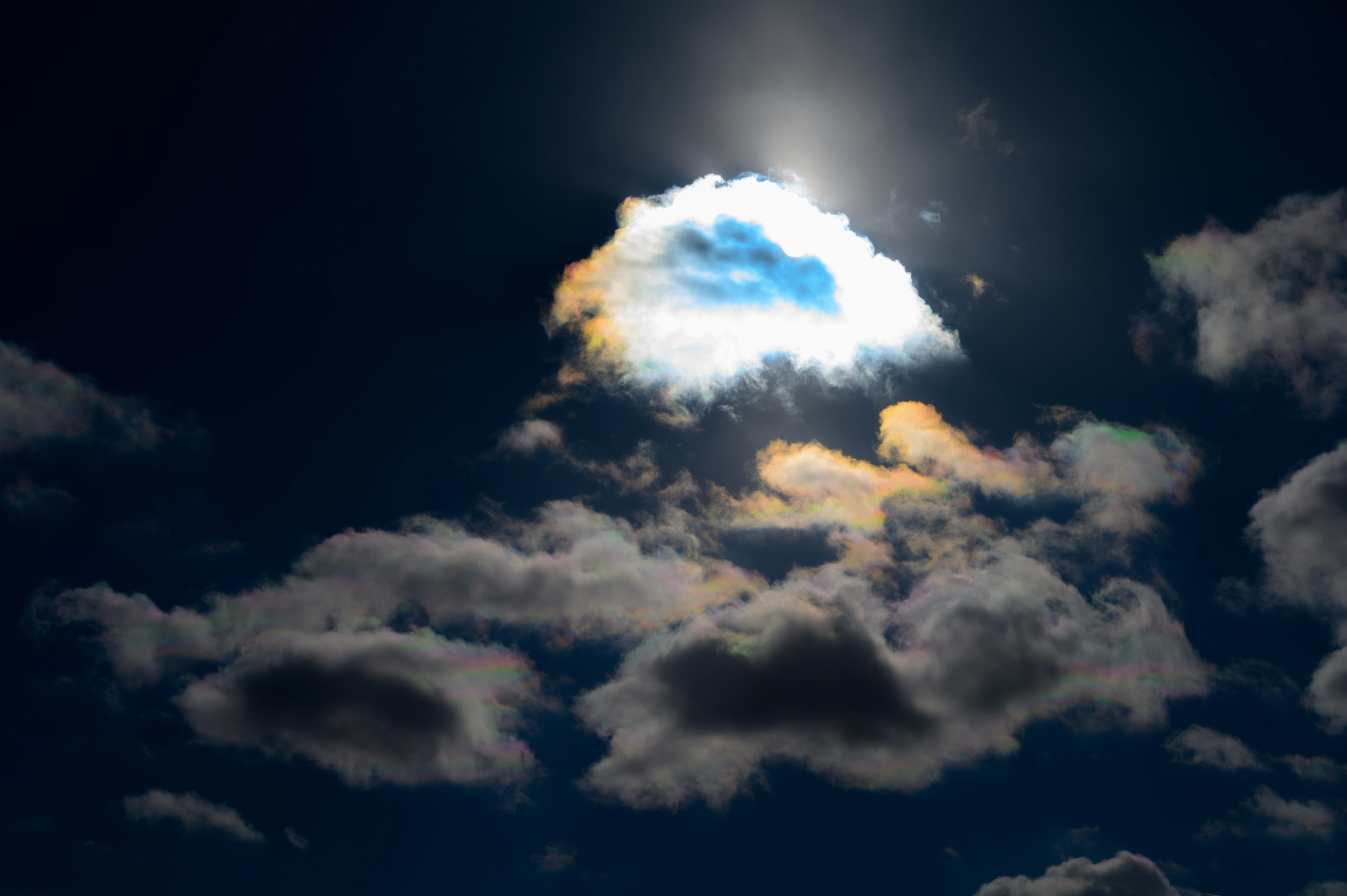 Contrast of clouds and light in a dark sky