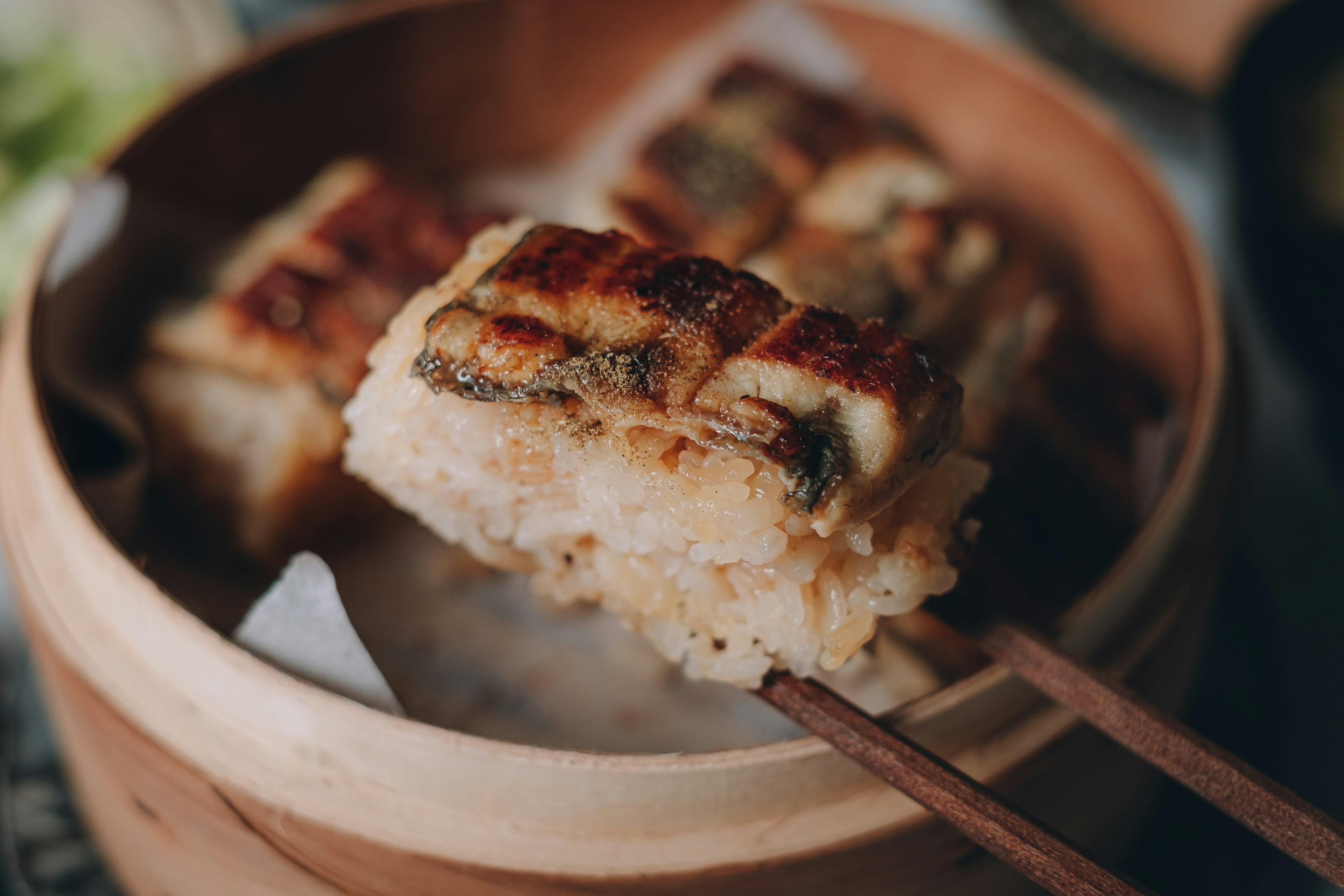 Close-up of grilled dumplings in a steamer