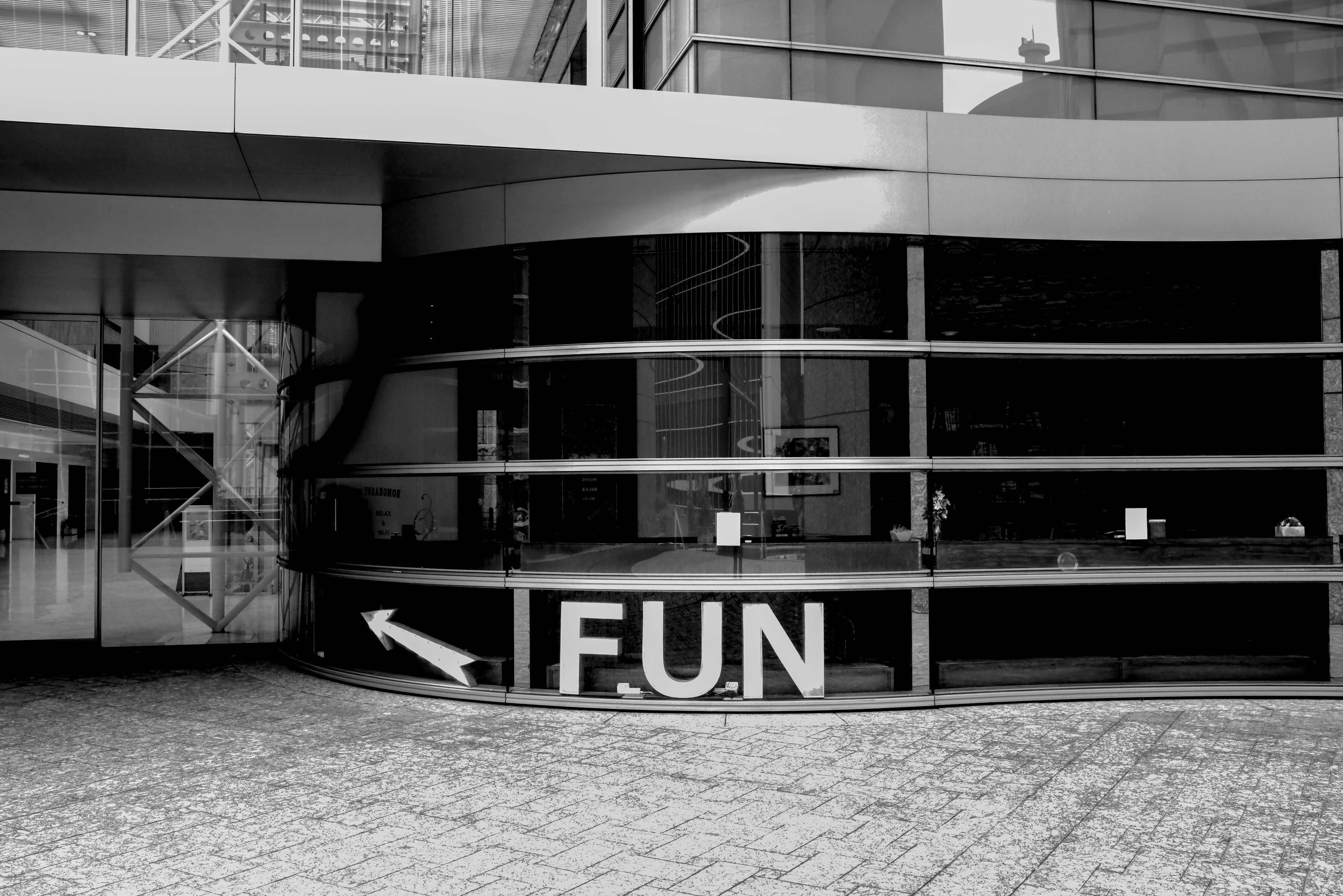 Large 'FUN' sign on the exterior of a black and white building