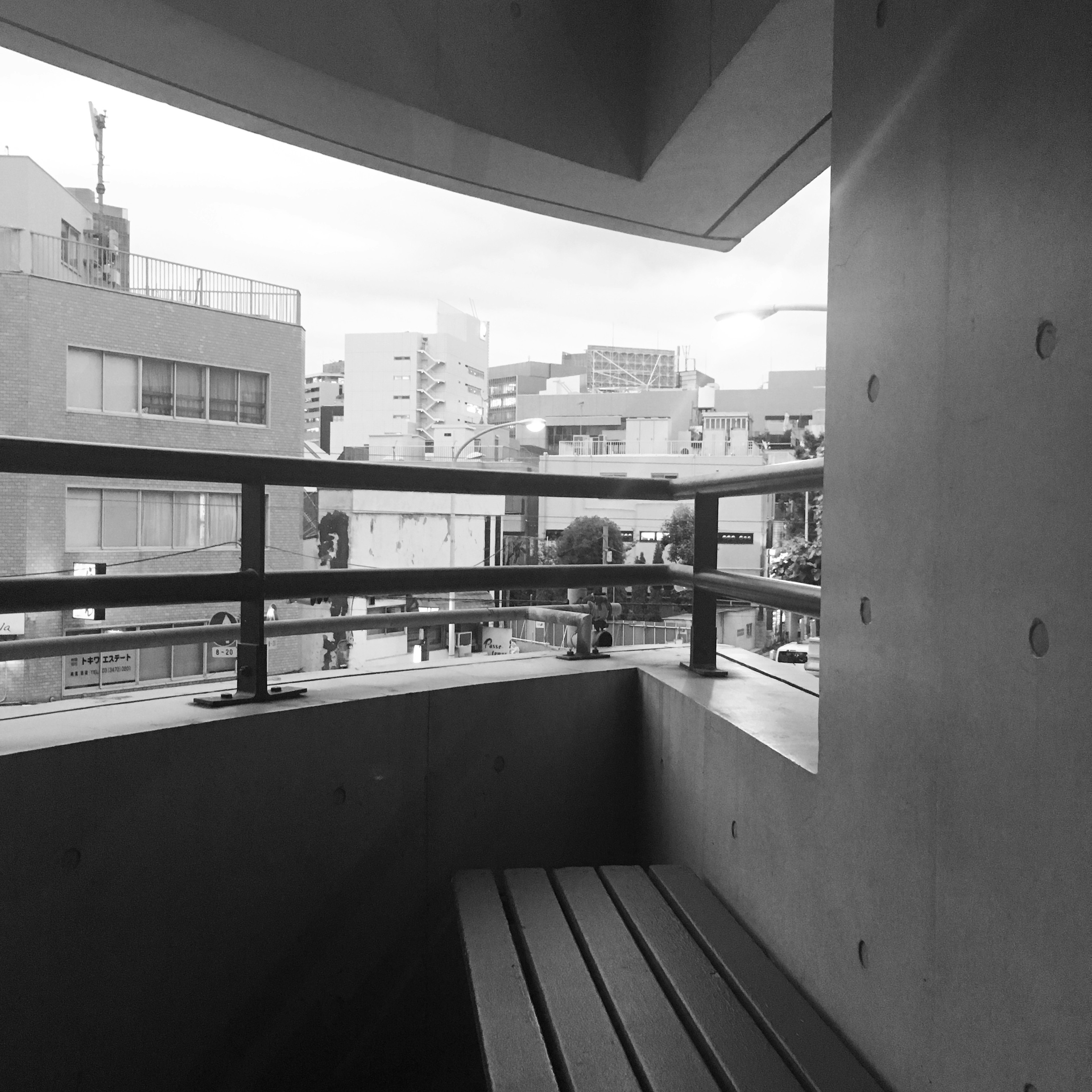 Concrete balcony overlooking a cityscape