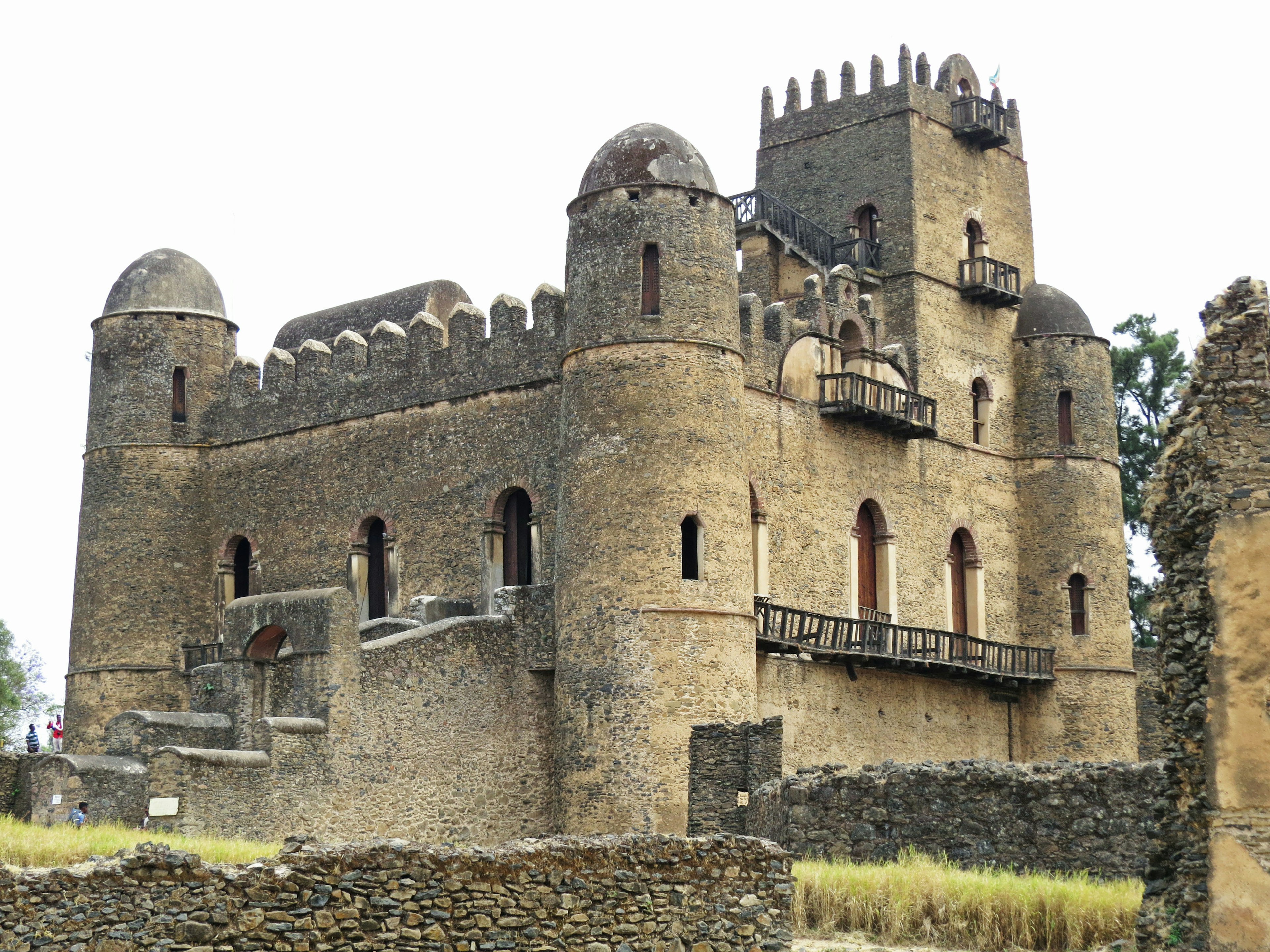 Ancient fortress in Ethiopia with stone walls and towers showcasing historical architecture