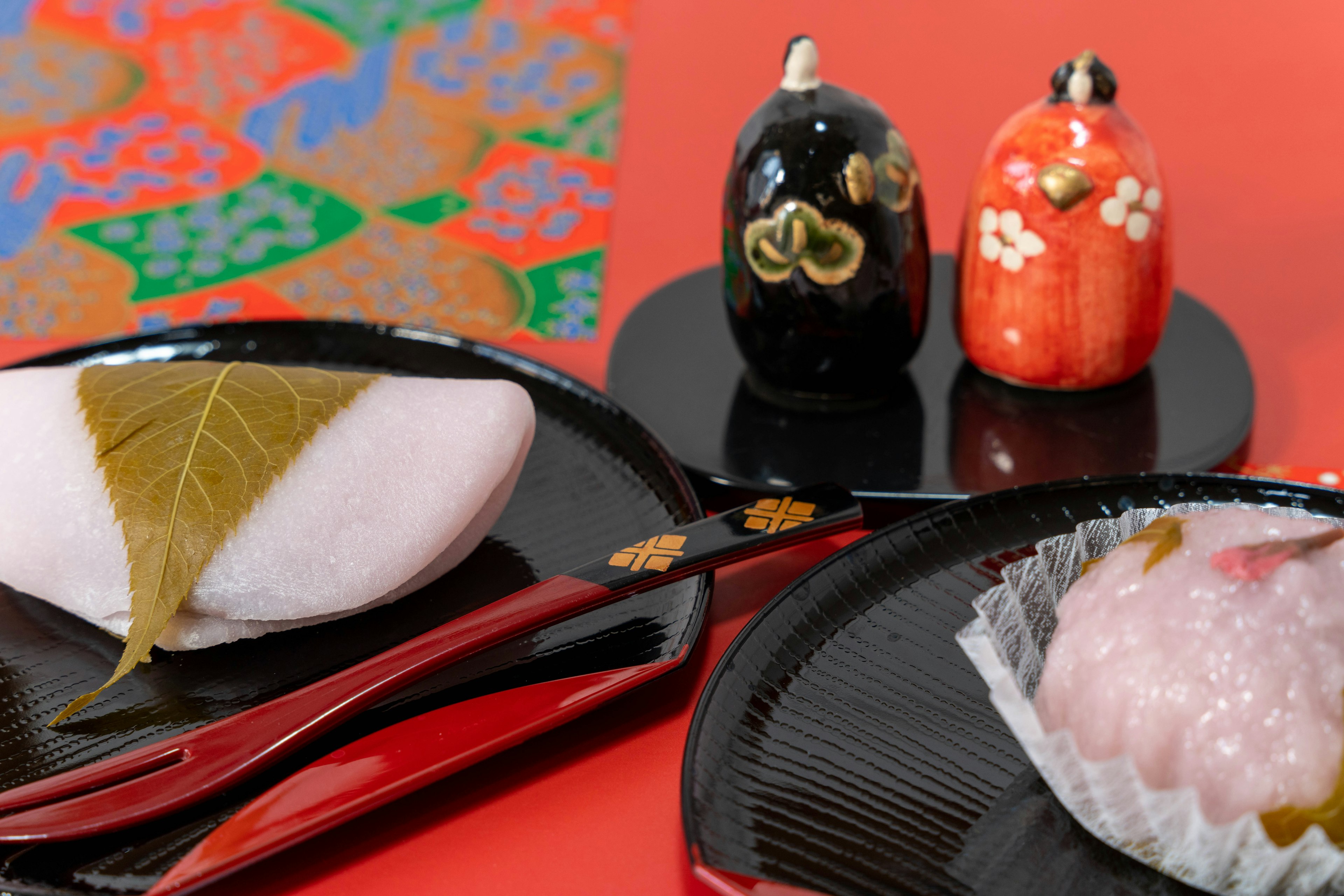 Colorful arrangement of traditional Japanese sweets with decorative figurines