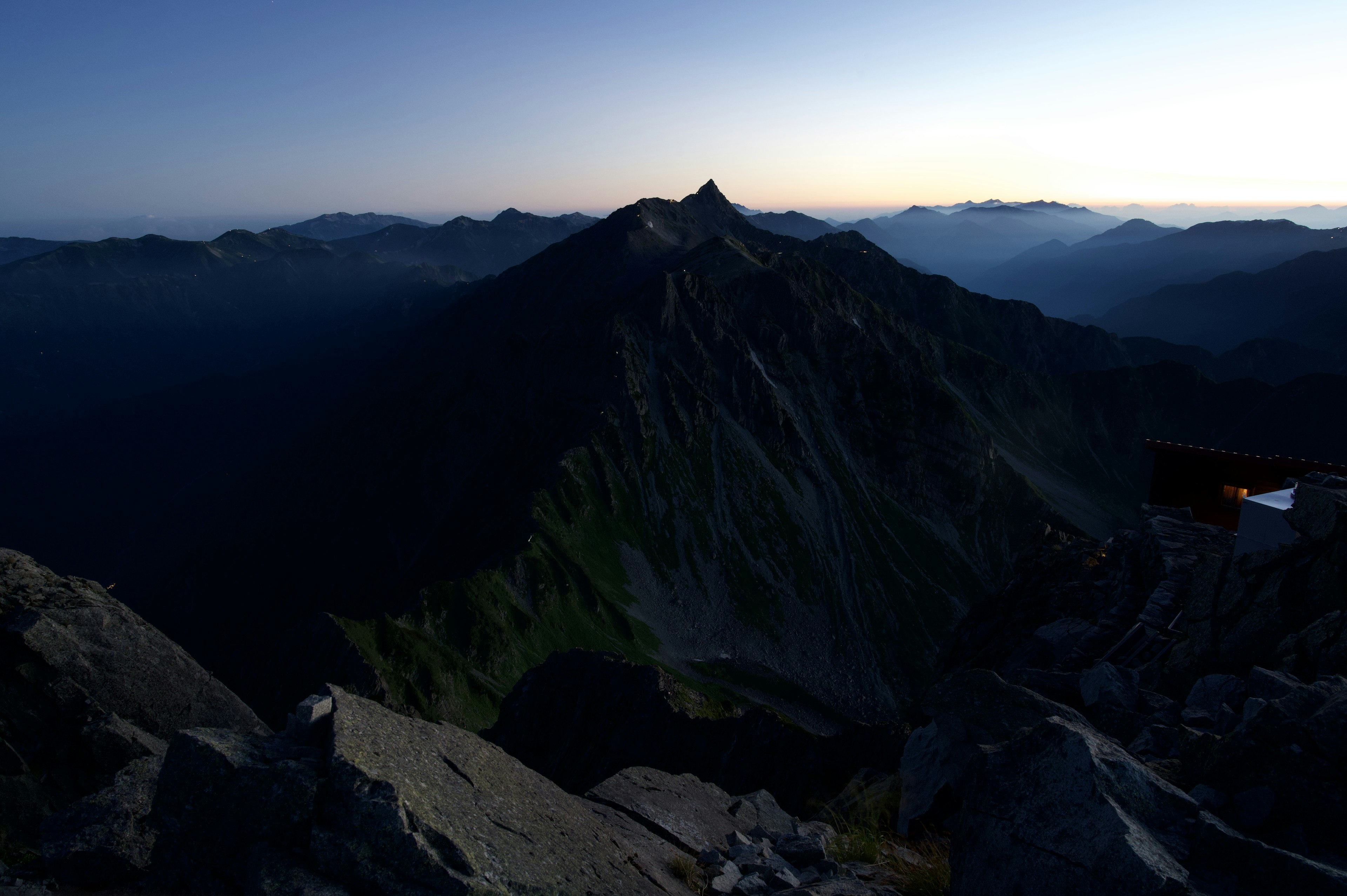 Dusk mountain landscape with contrasting light and shadow