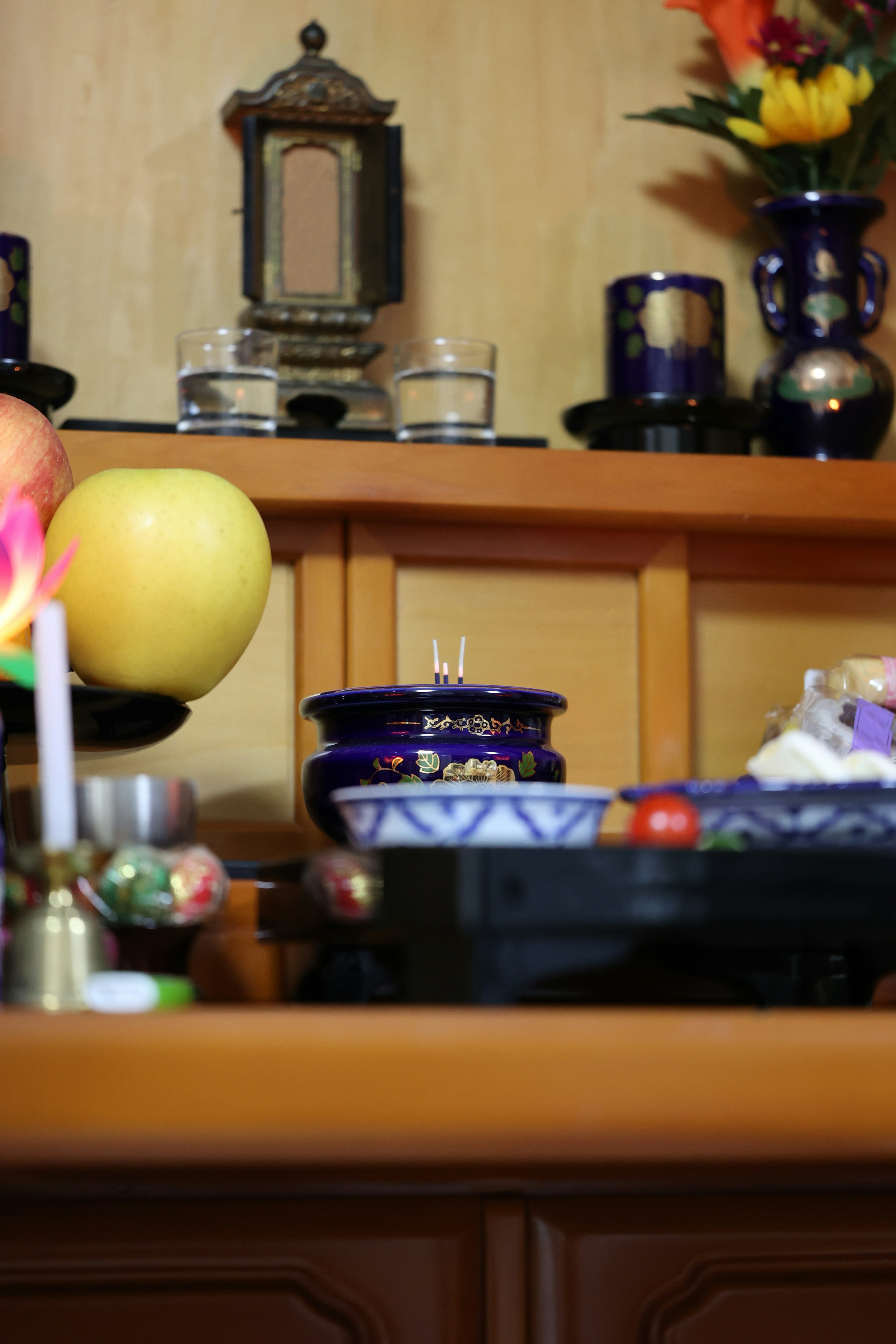 Decorative shelf with colorful fruits and candles