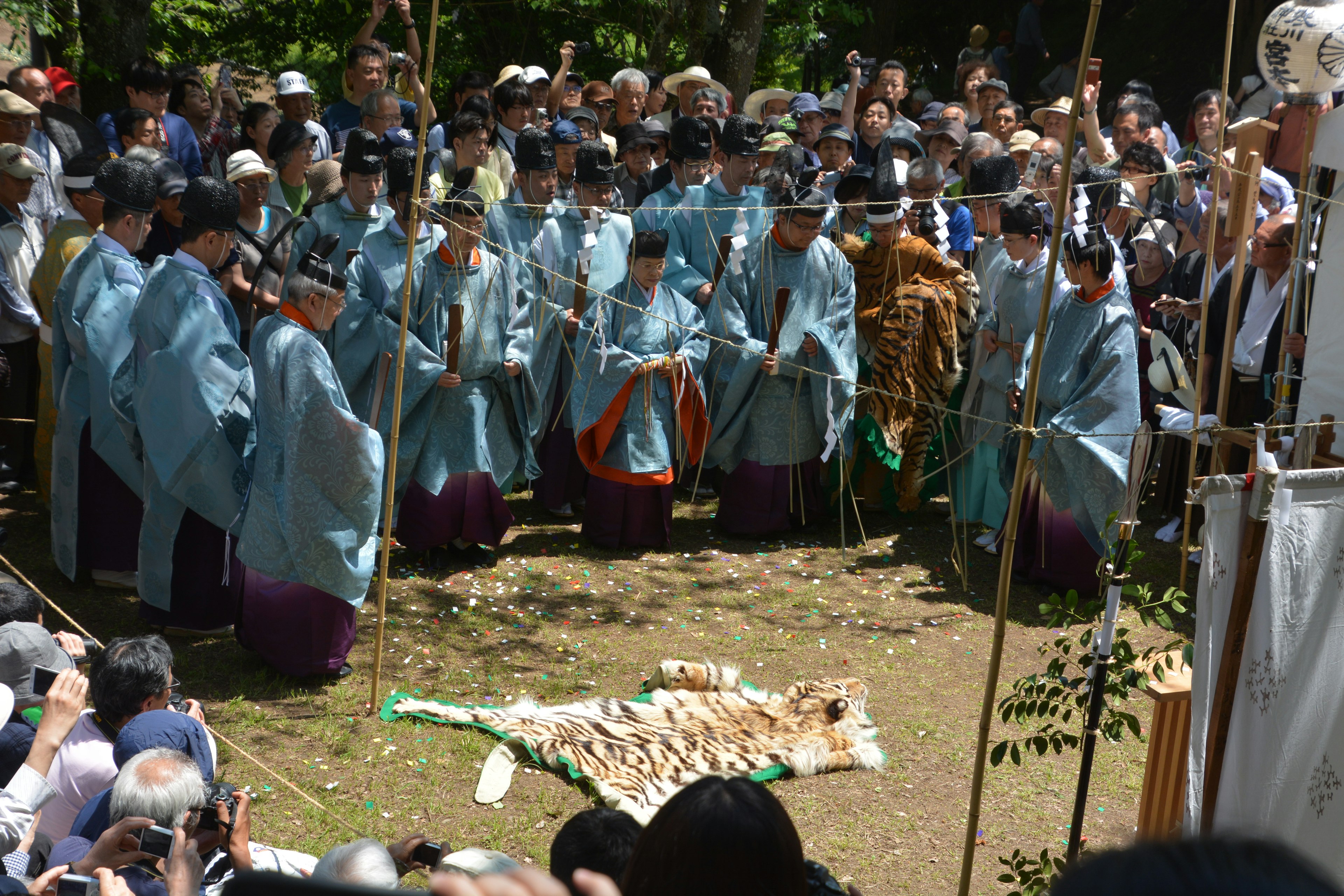 Gathering of people in blue garments at a festival