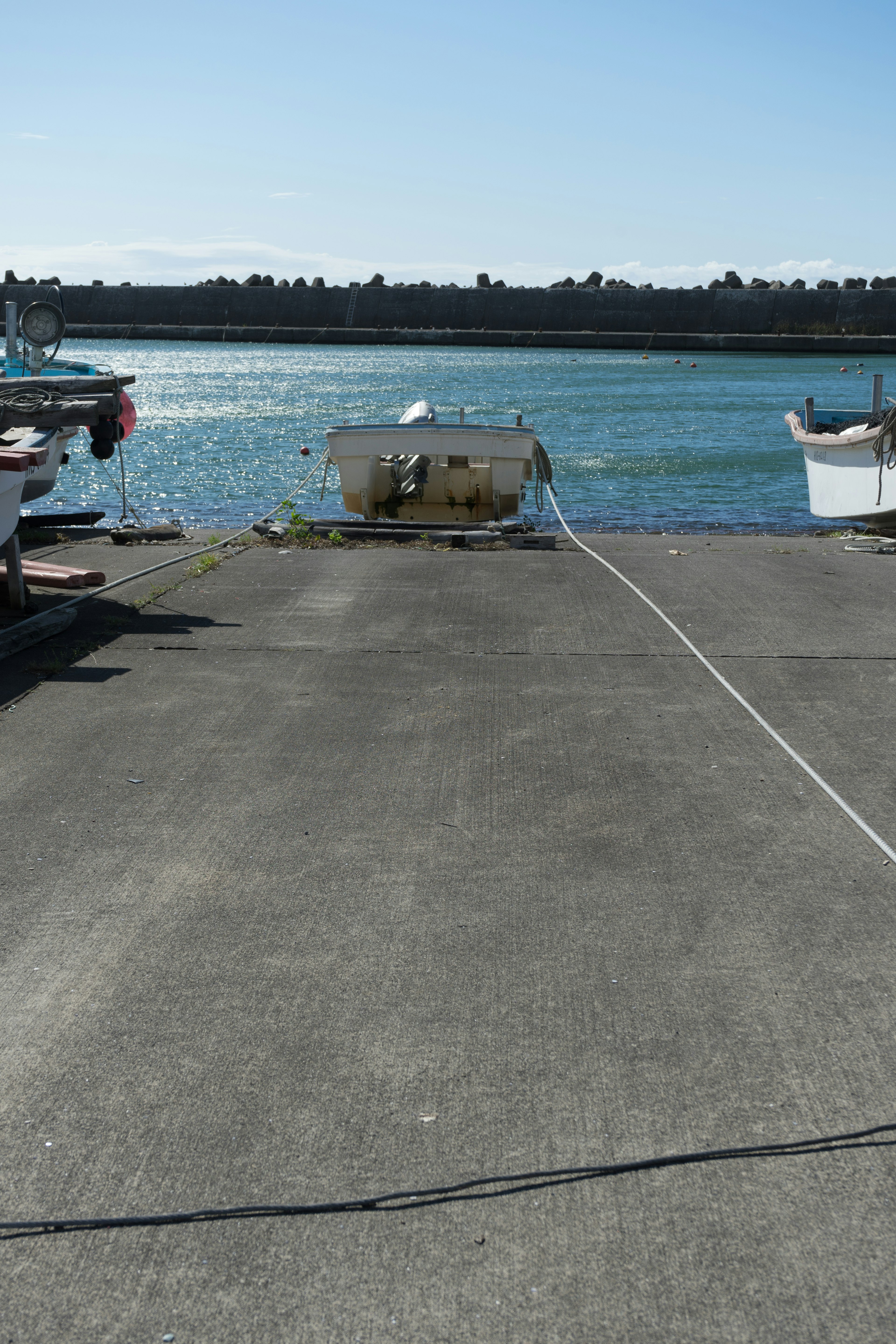 A view of boats docked at a marina with calm water