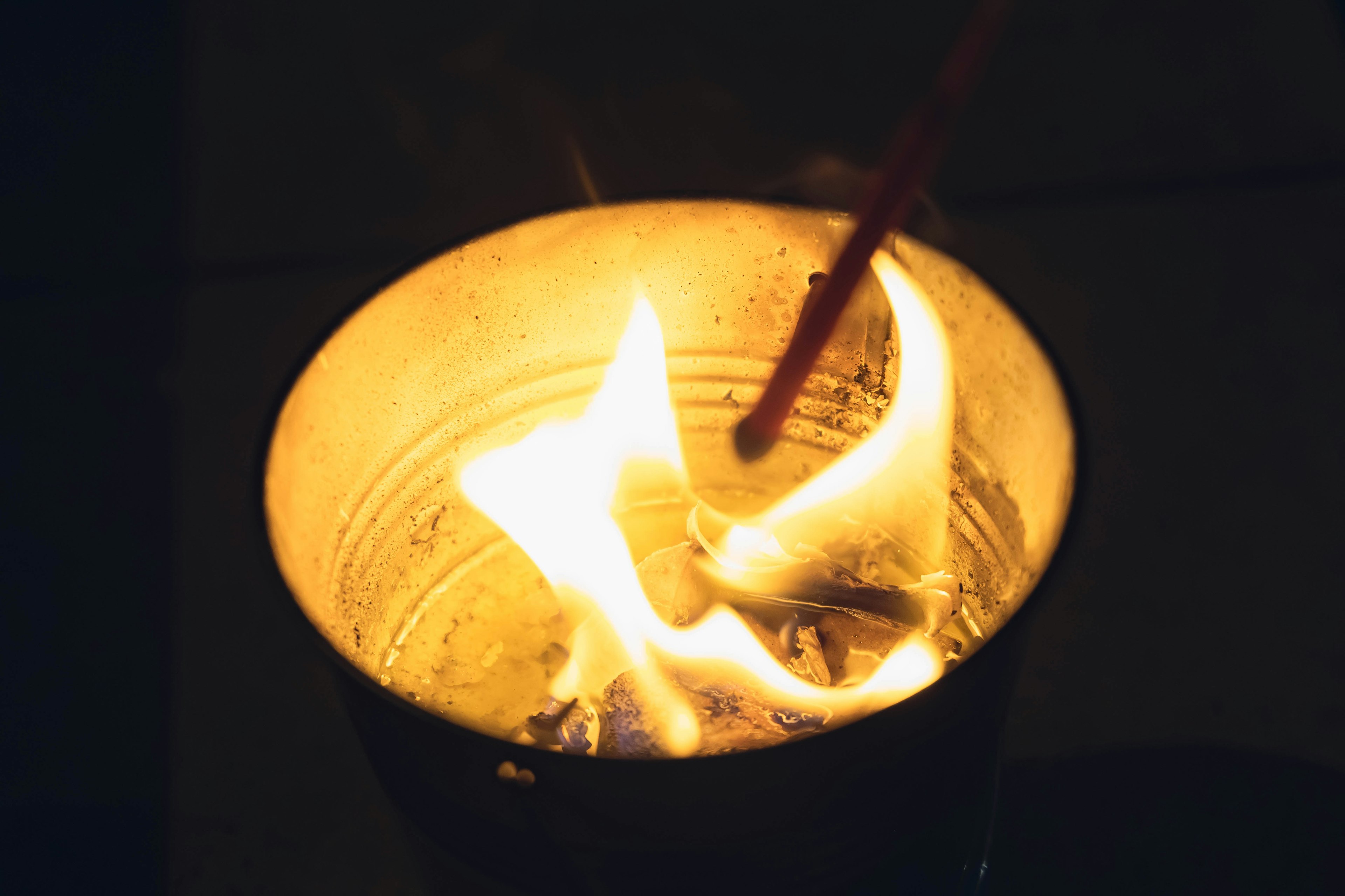 Flames burning inside a metal can