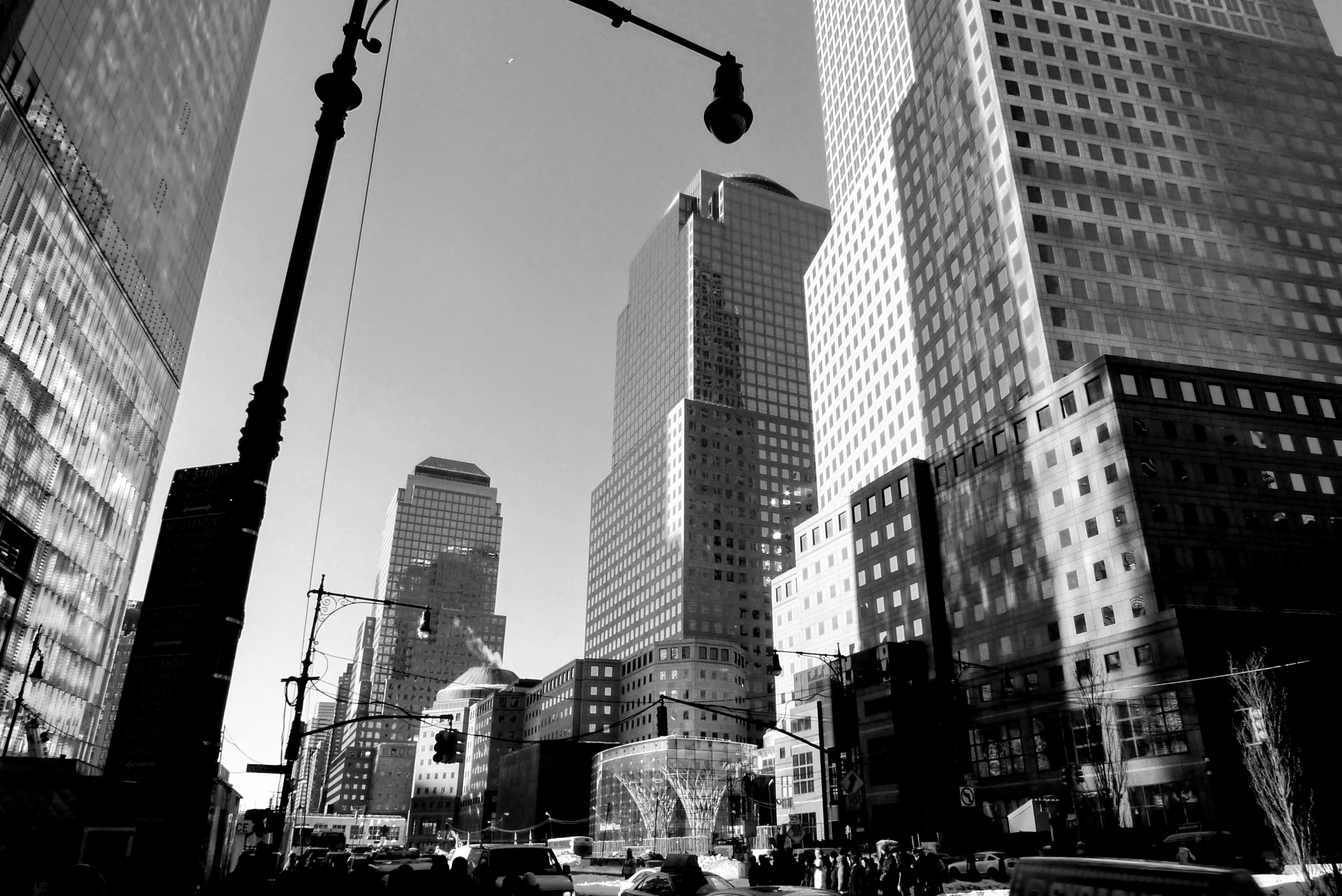 Black and white cityscape featuring tall skyscrapers and urban architecture