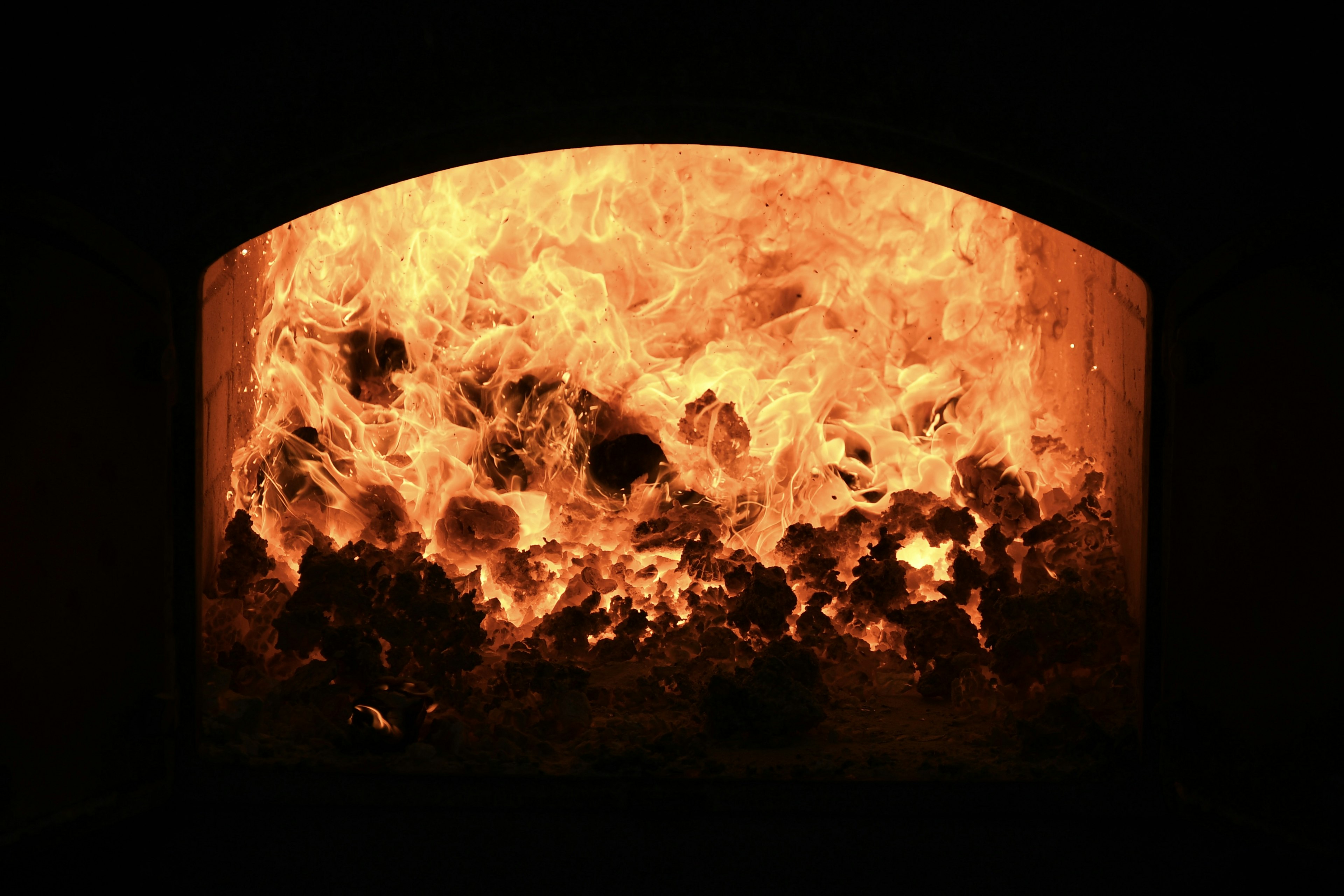 Interior view of a furnace with intense flames