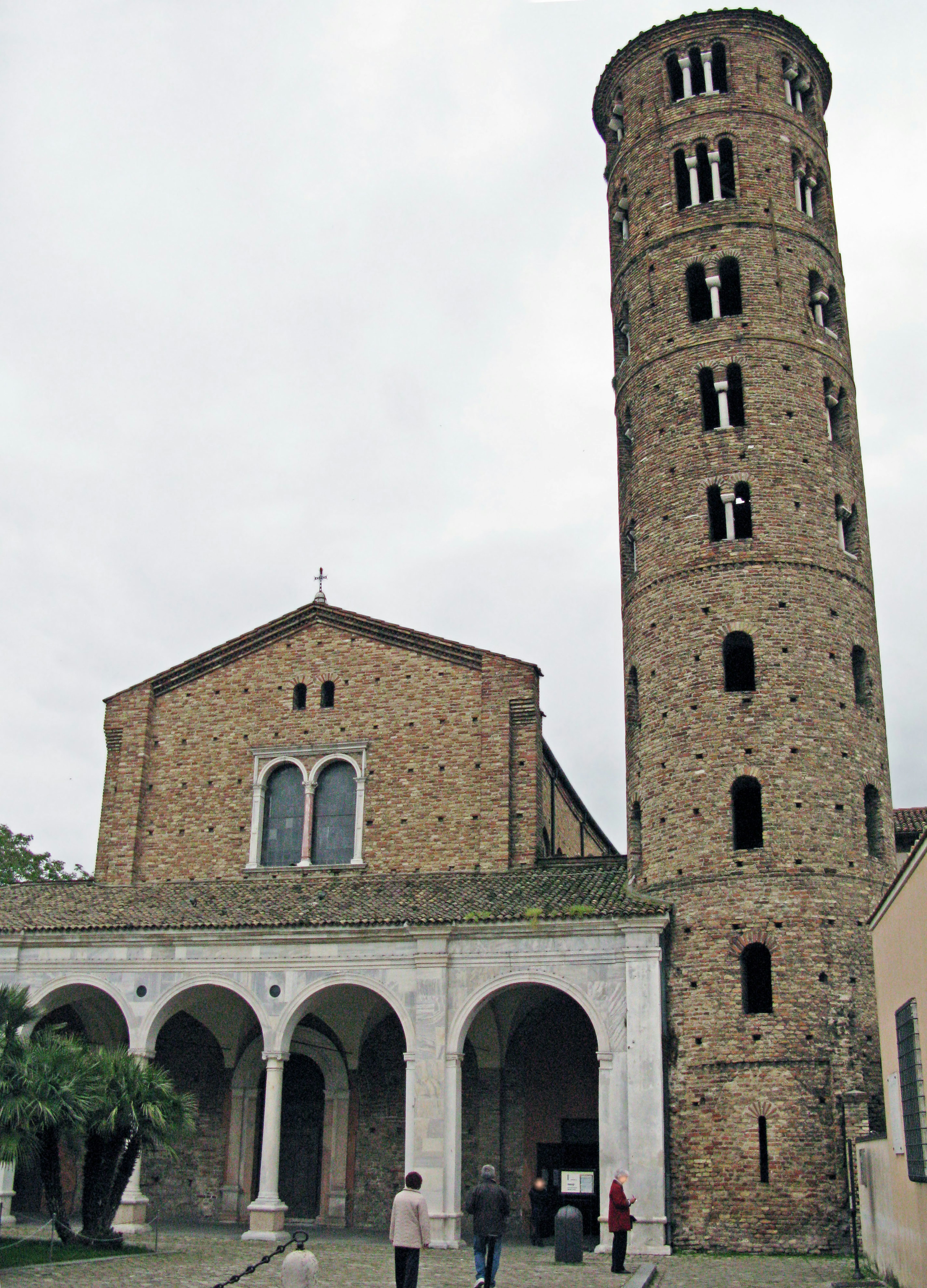 Historic stone church and tower in a courtyard