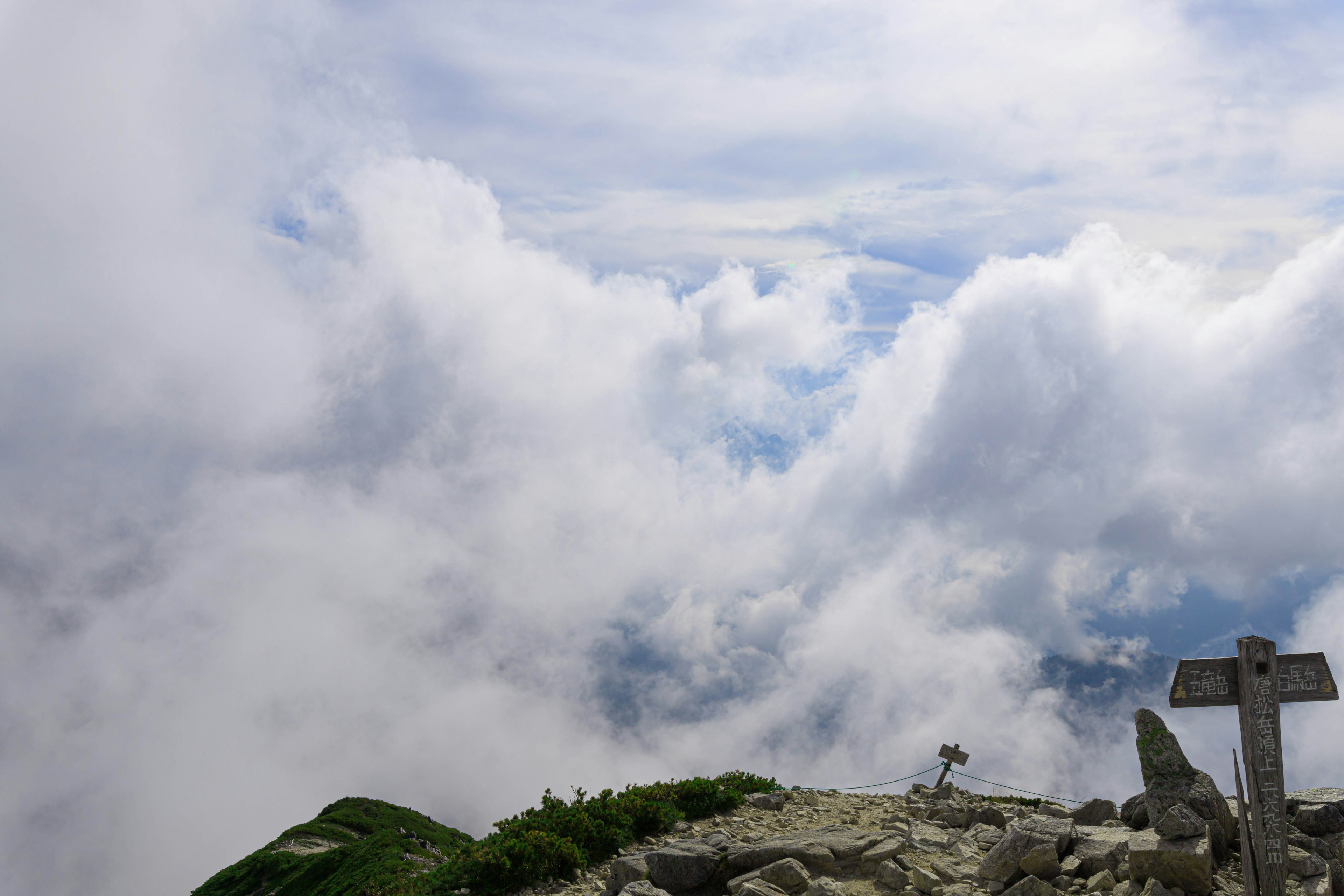 Scenic view from a mountain peak overlooking a sea of clouds