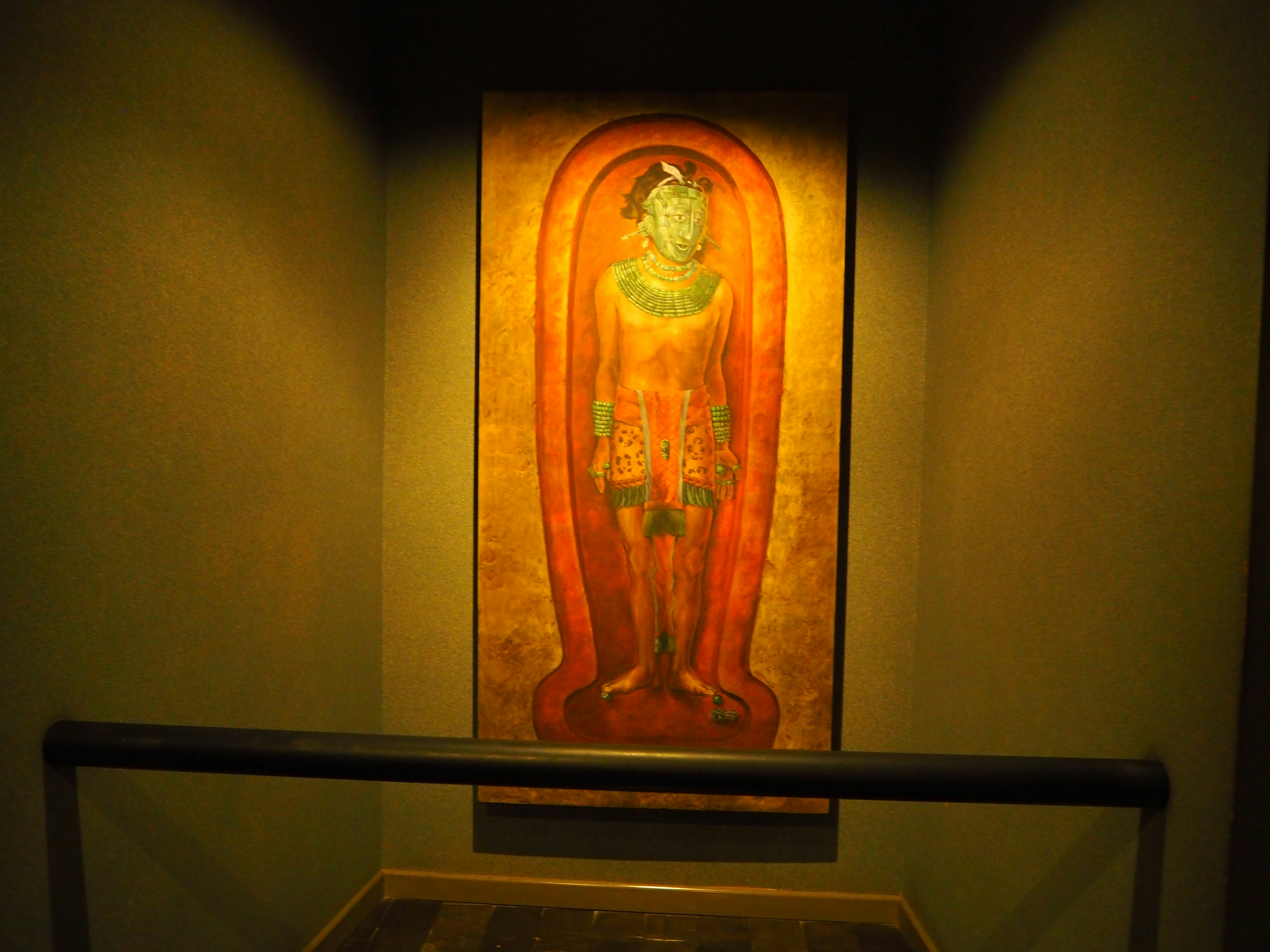 A painting of a Buddha figure on the wall Bright colors and intricate patterns