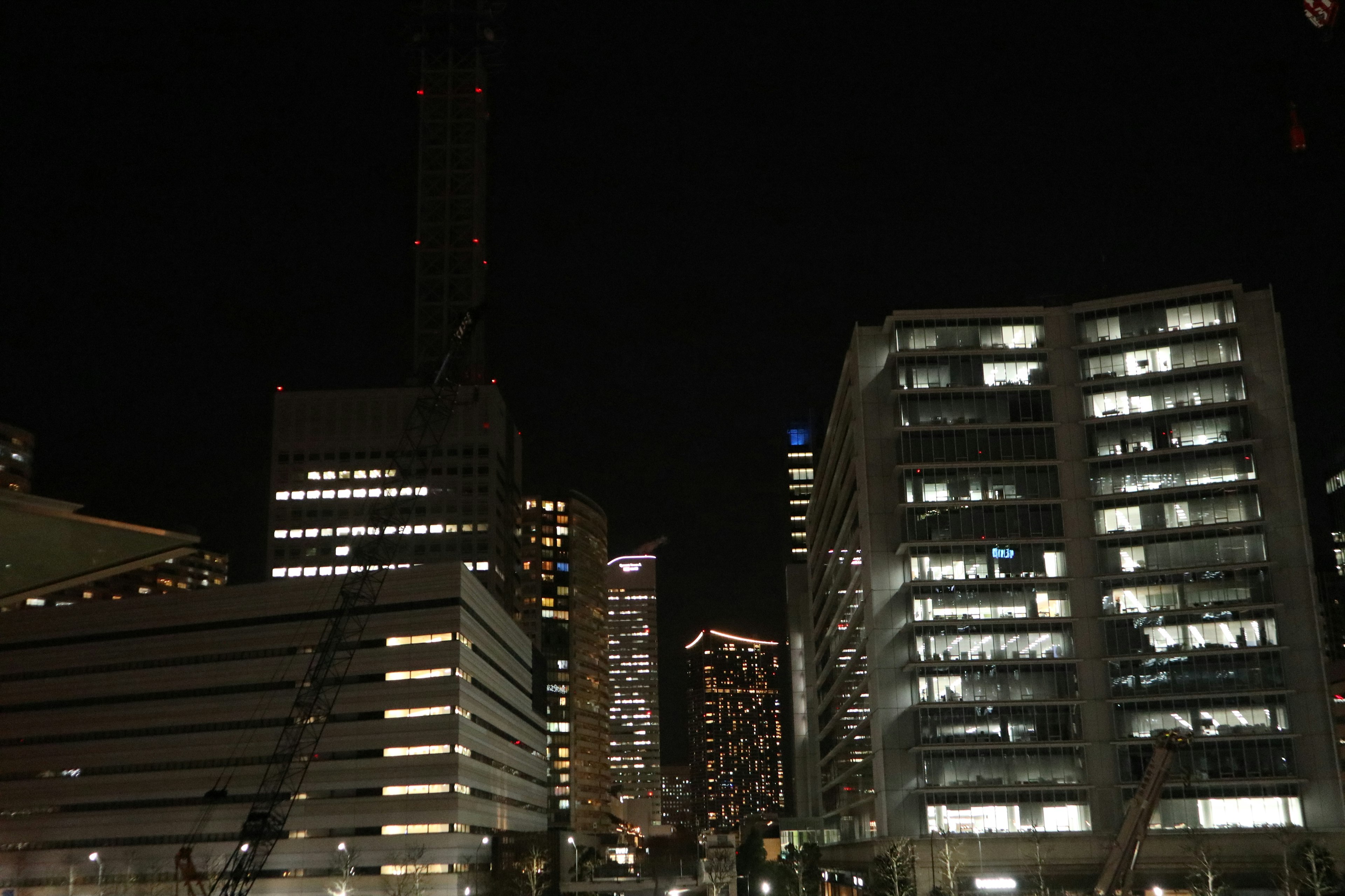 City skyline at night with illuminated buildings