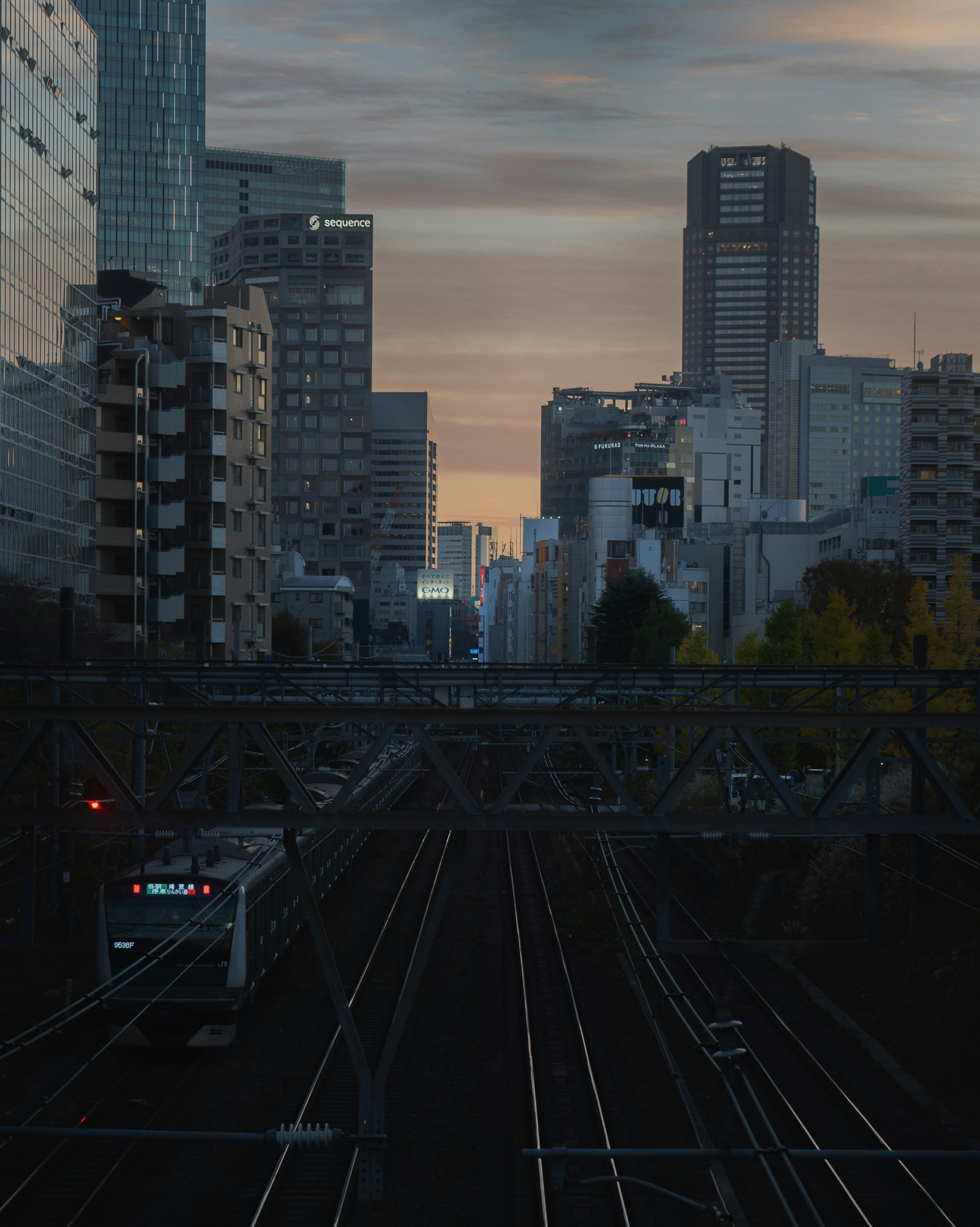 Urban landscape featuring railway tracks and skyscrapers