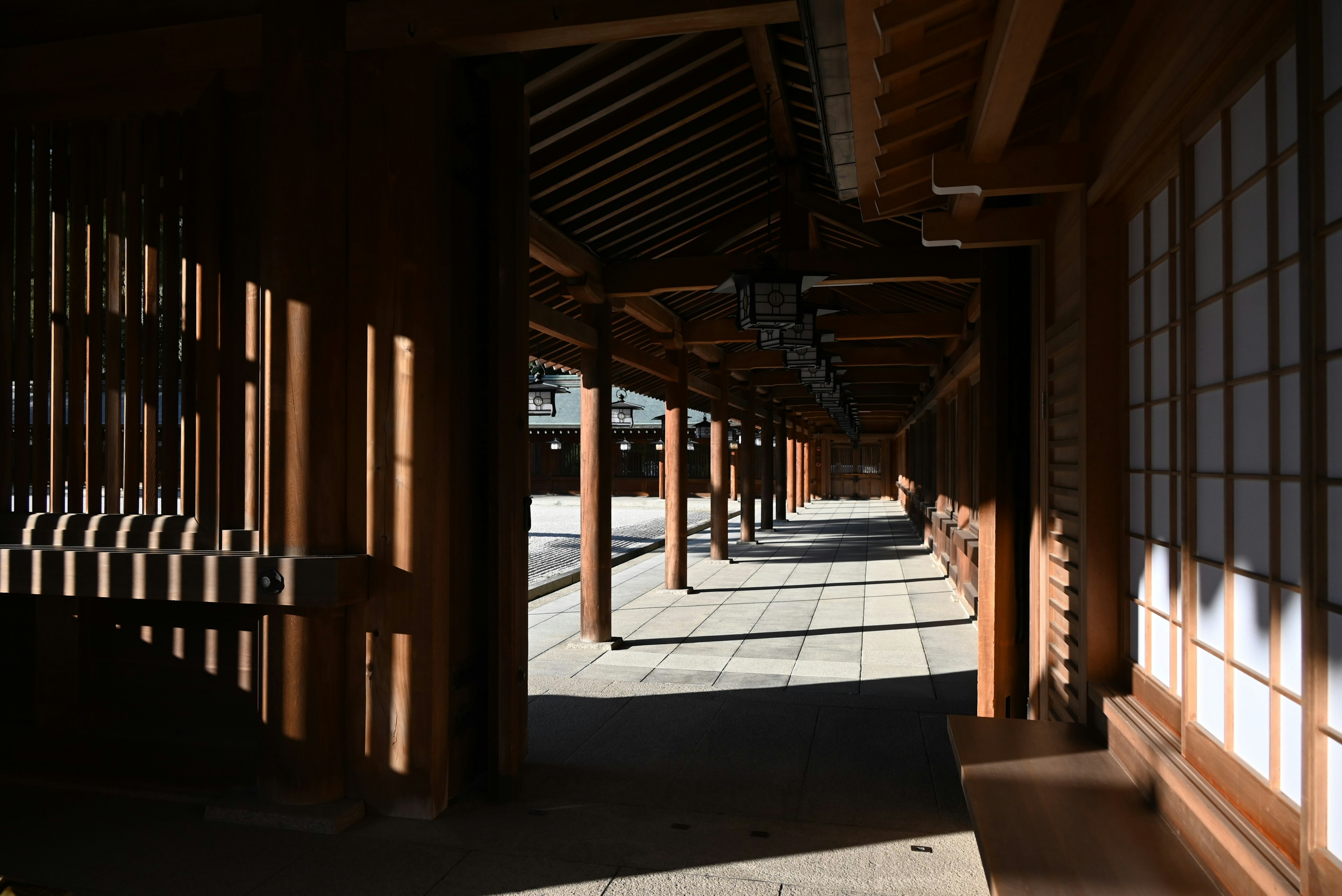 Traditional Japanese architectural corridor illuminated by shadows and light