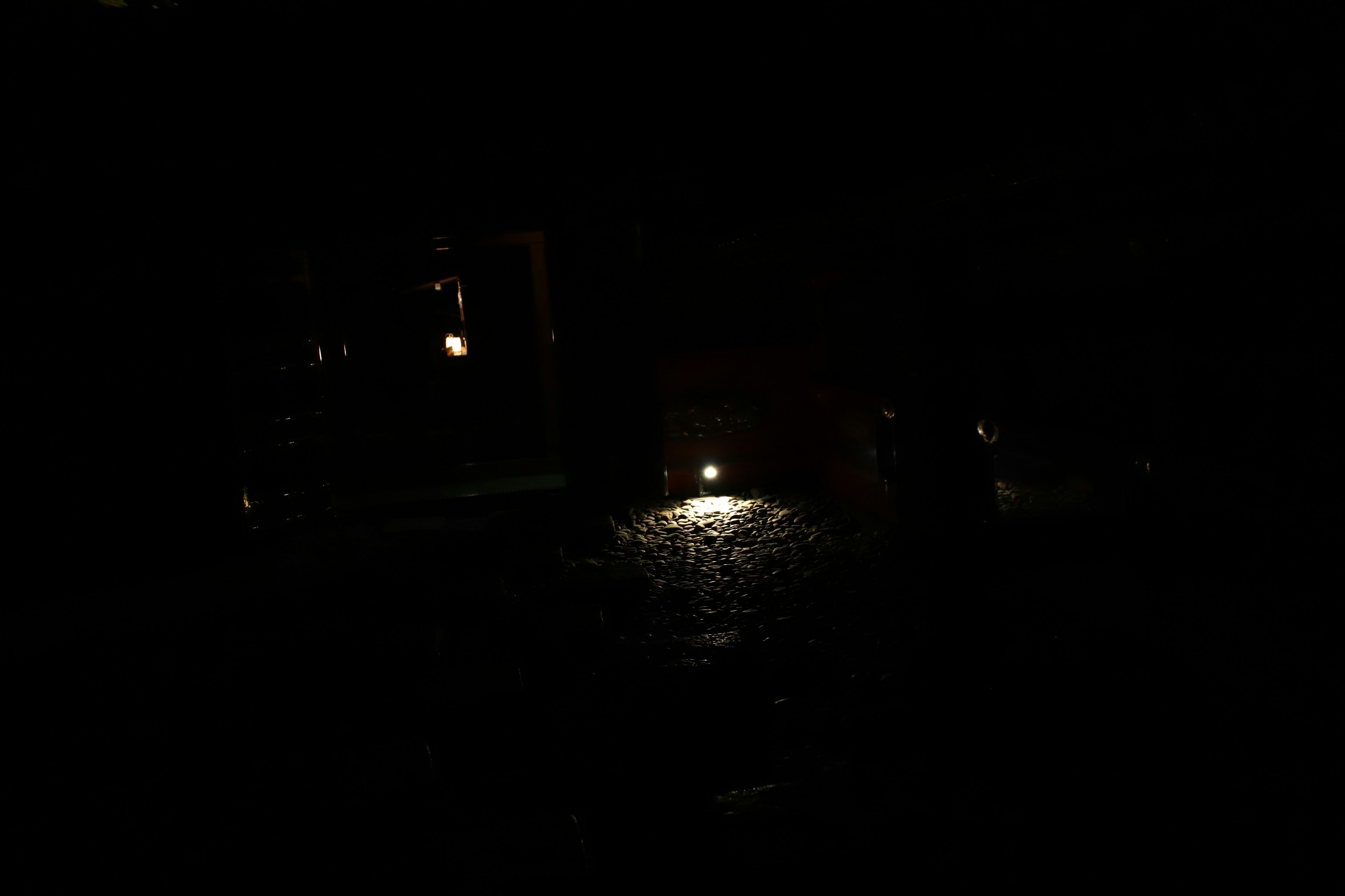 Dimly lit night scene with a glowing light