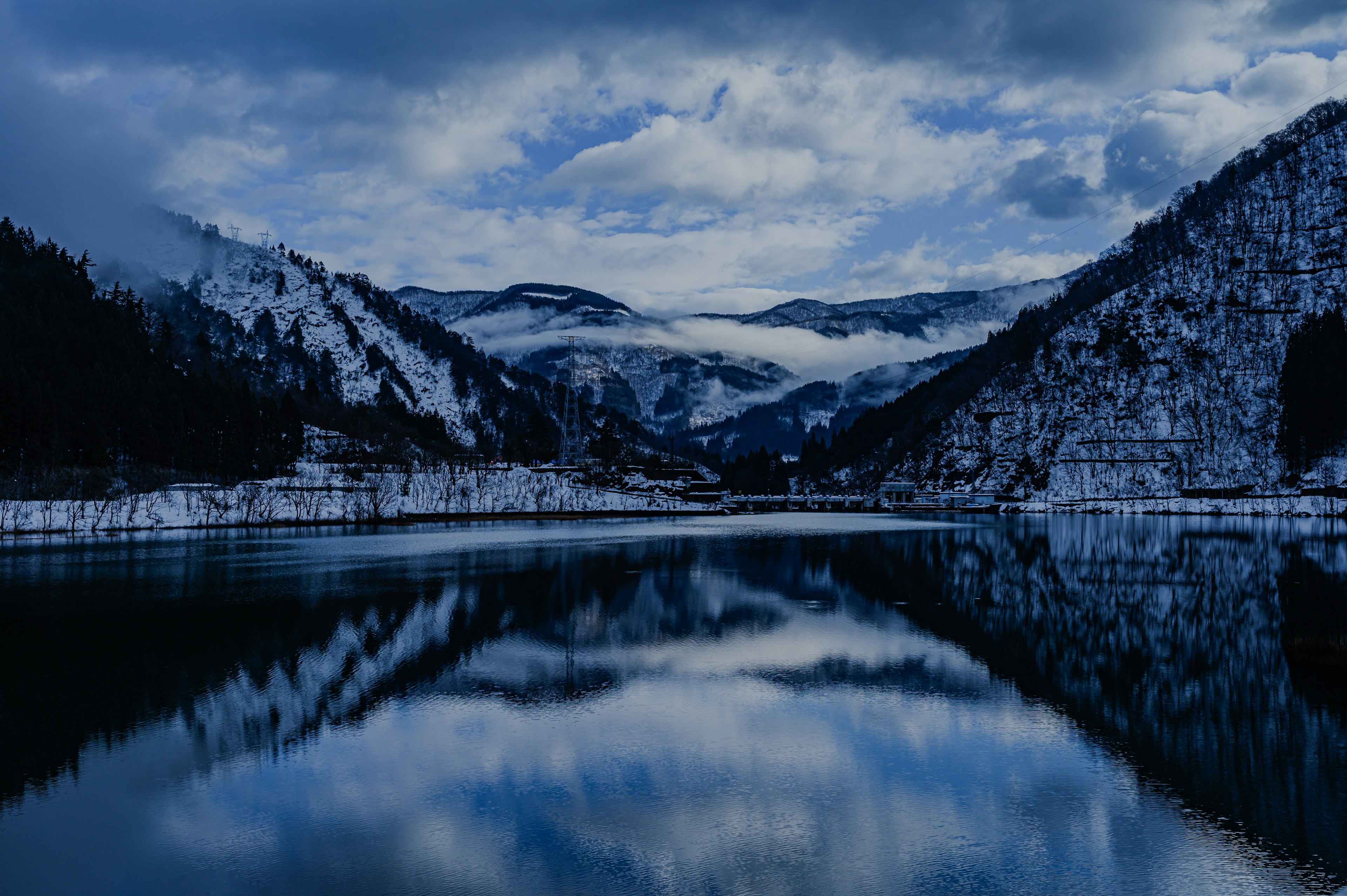 Snow-covered mountains and a tranquil lake landscape