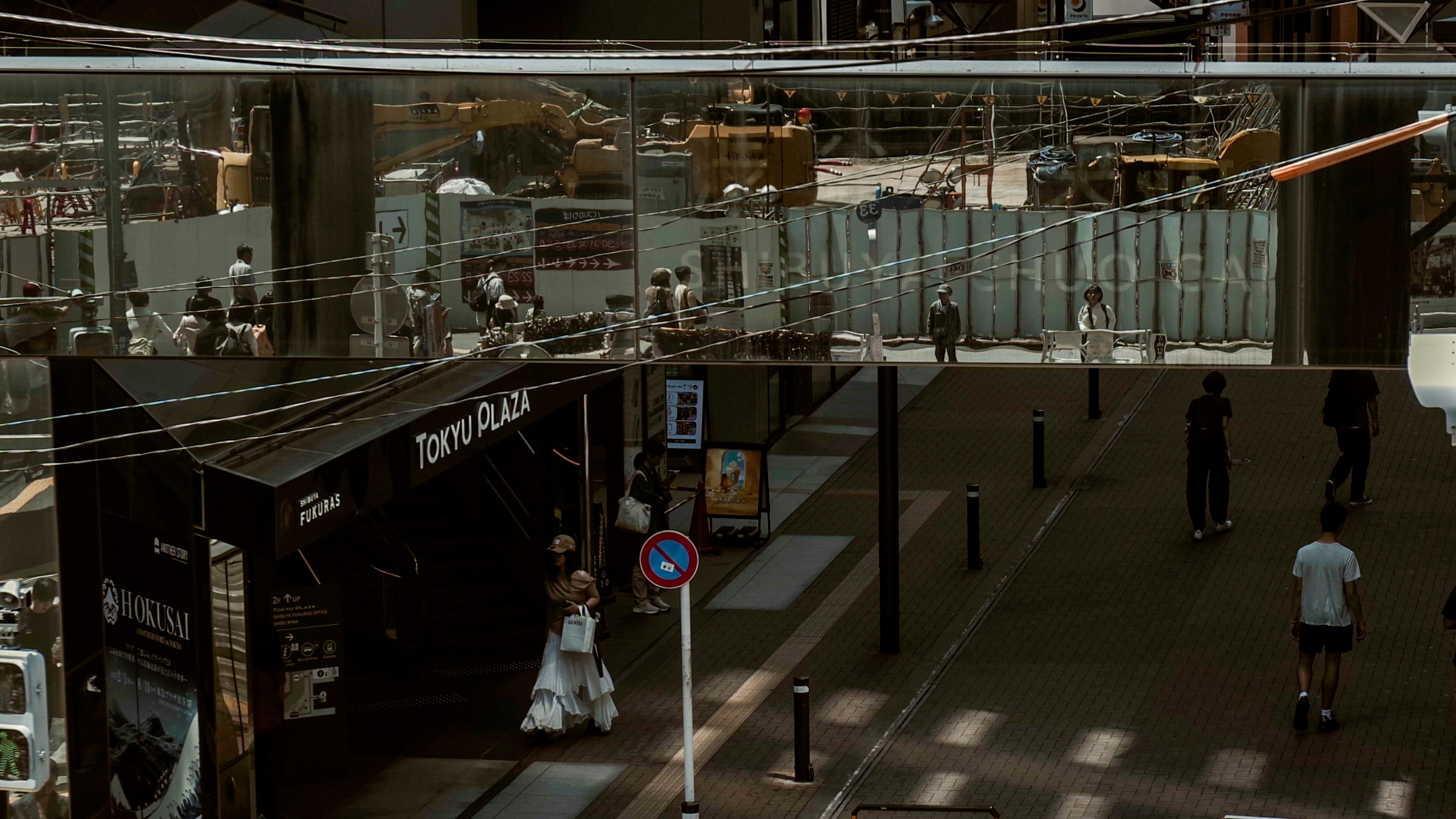 Interior view of a modern commercial space with people walking