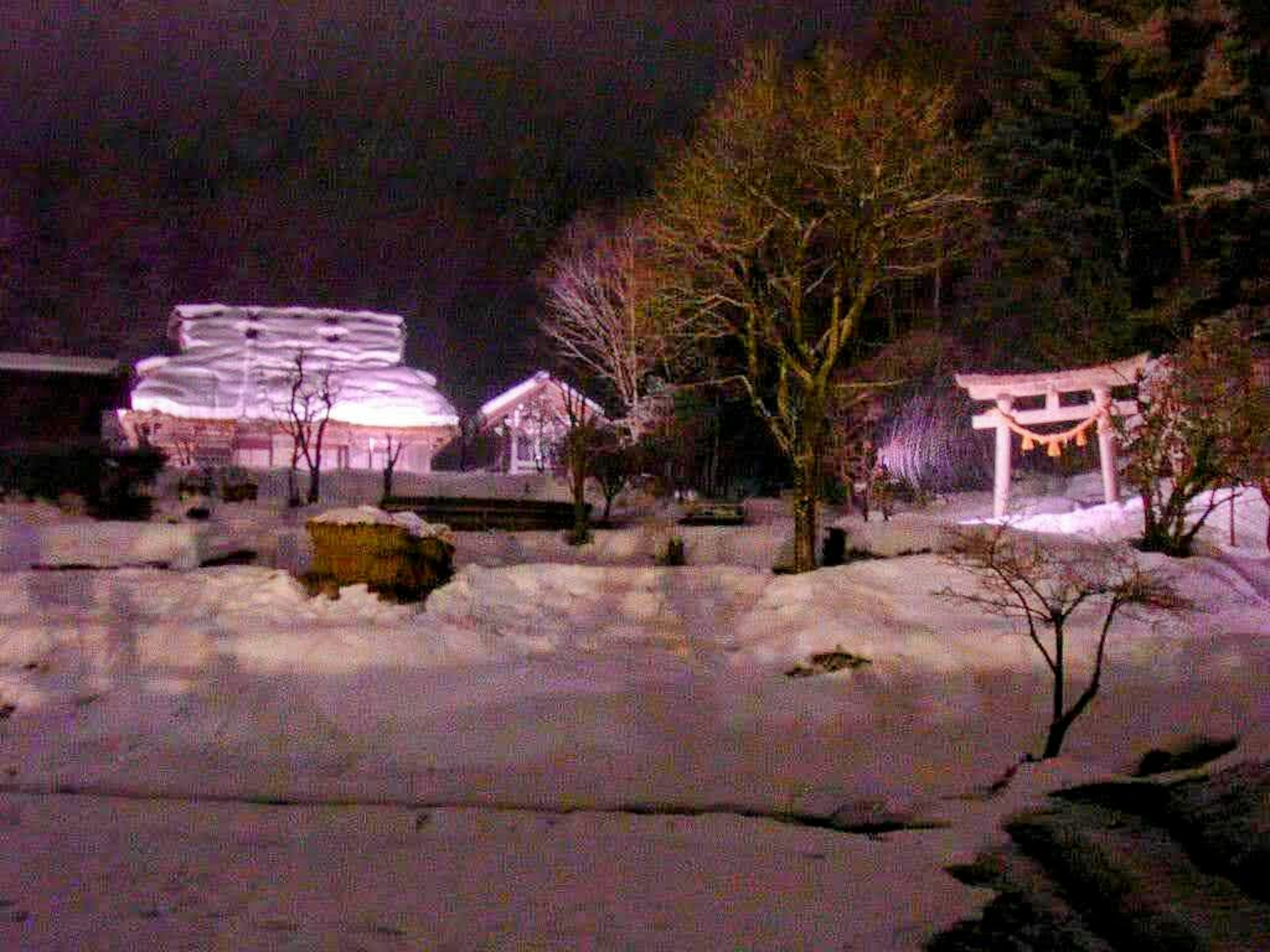 Snow-covered shrine and old buildings landscape