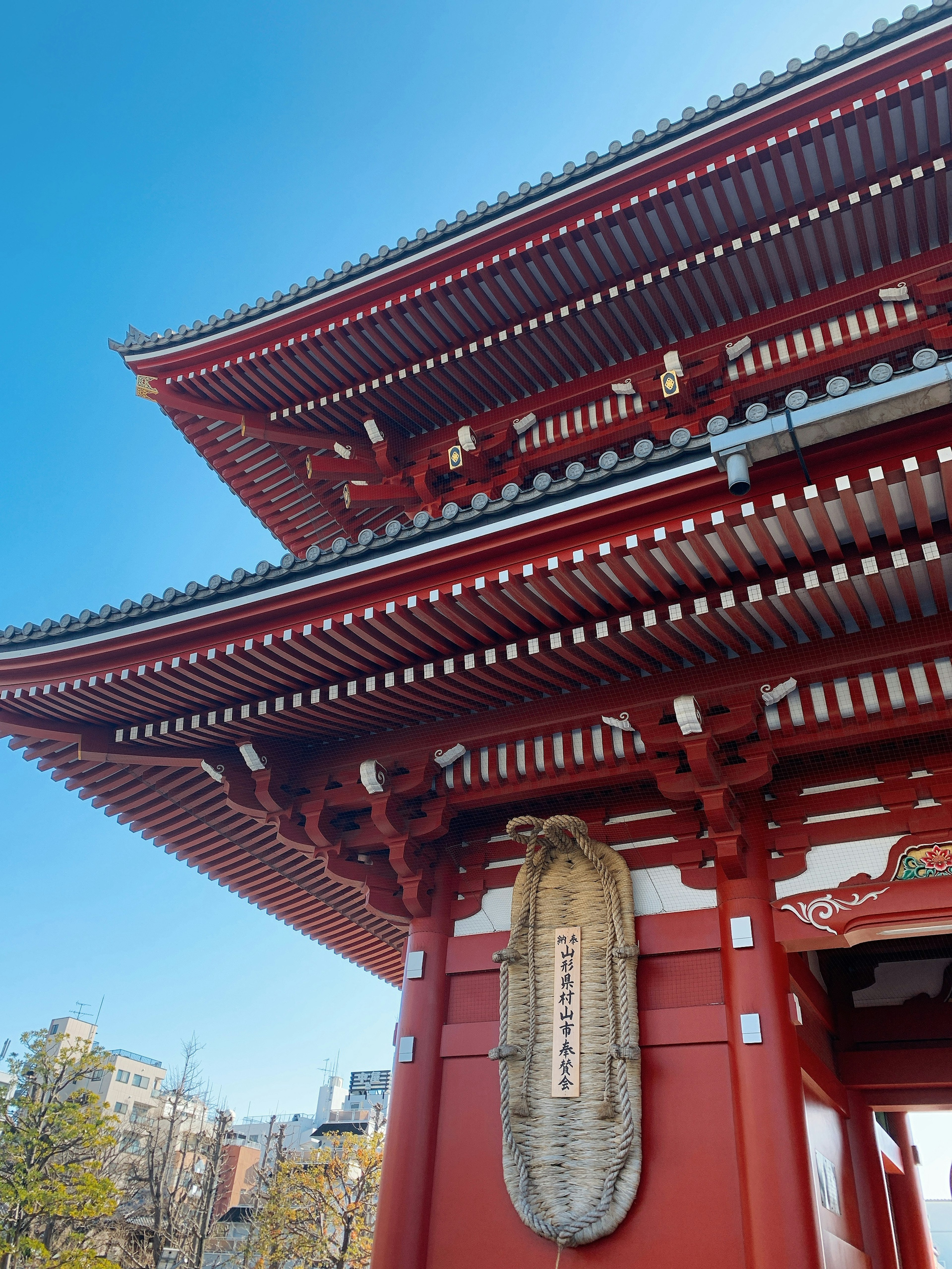 Close-up of Senso-ji Temple's red roof and large lantern