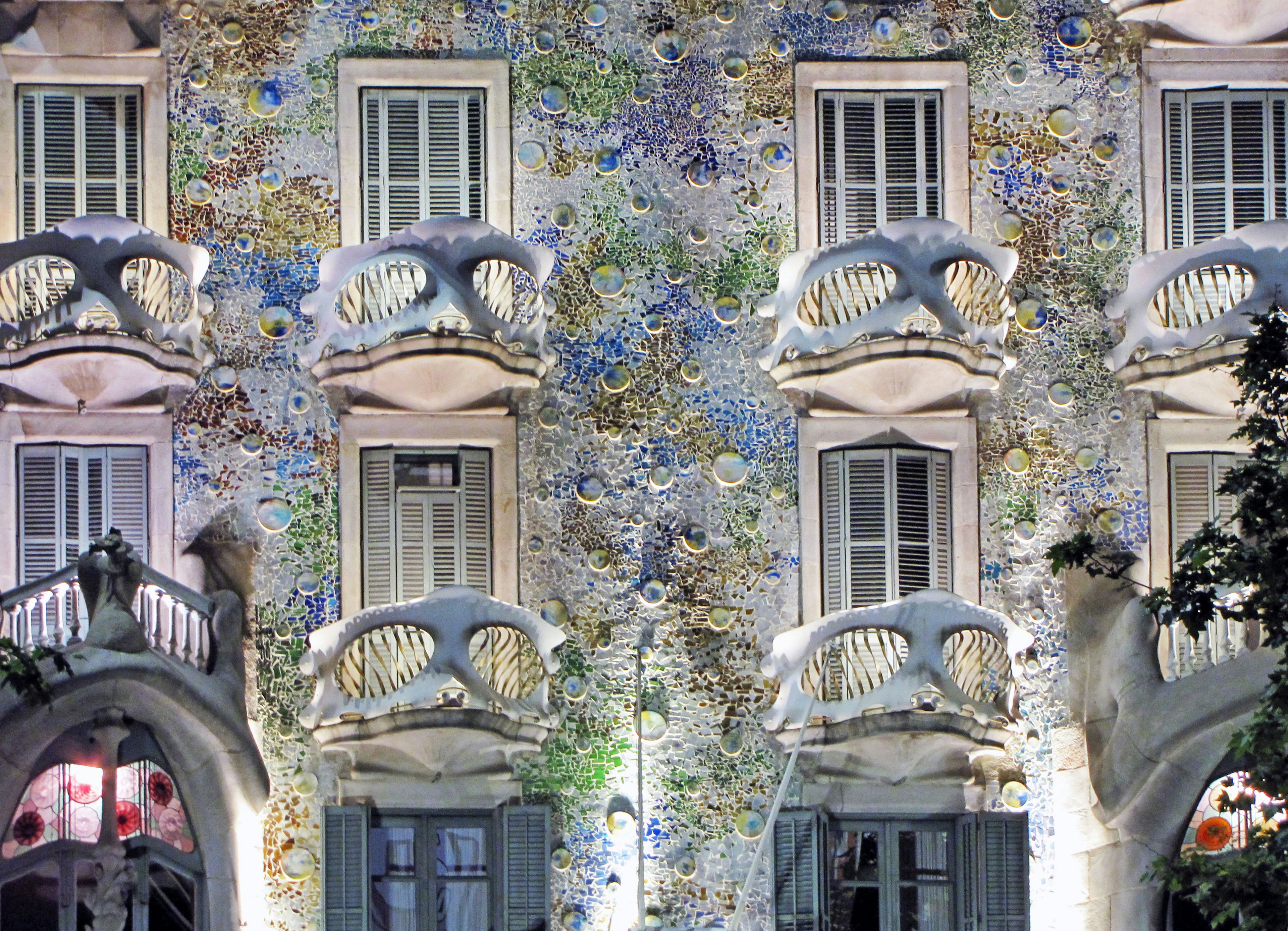 Facade of a beautifully decorated building featuring vibrant floral and plant motifs