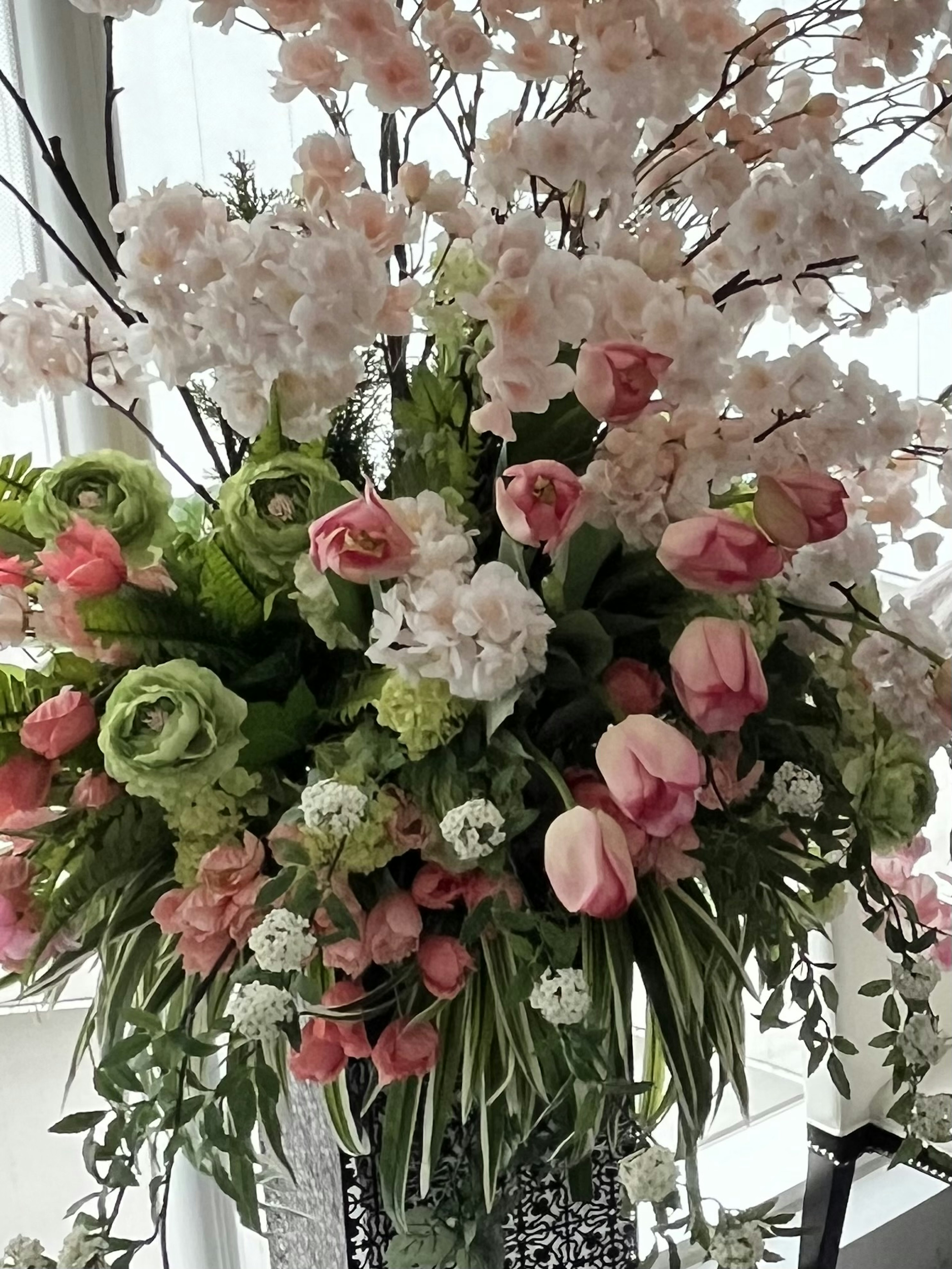 A beautiful bouquet filled with colorful flowers featuring white and pink roses and tulips