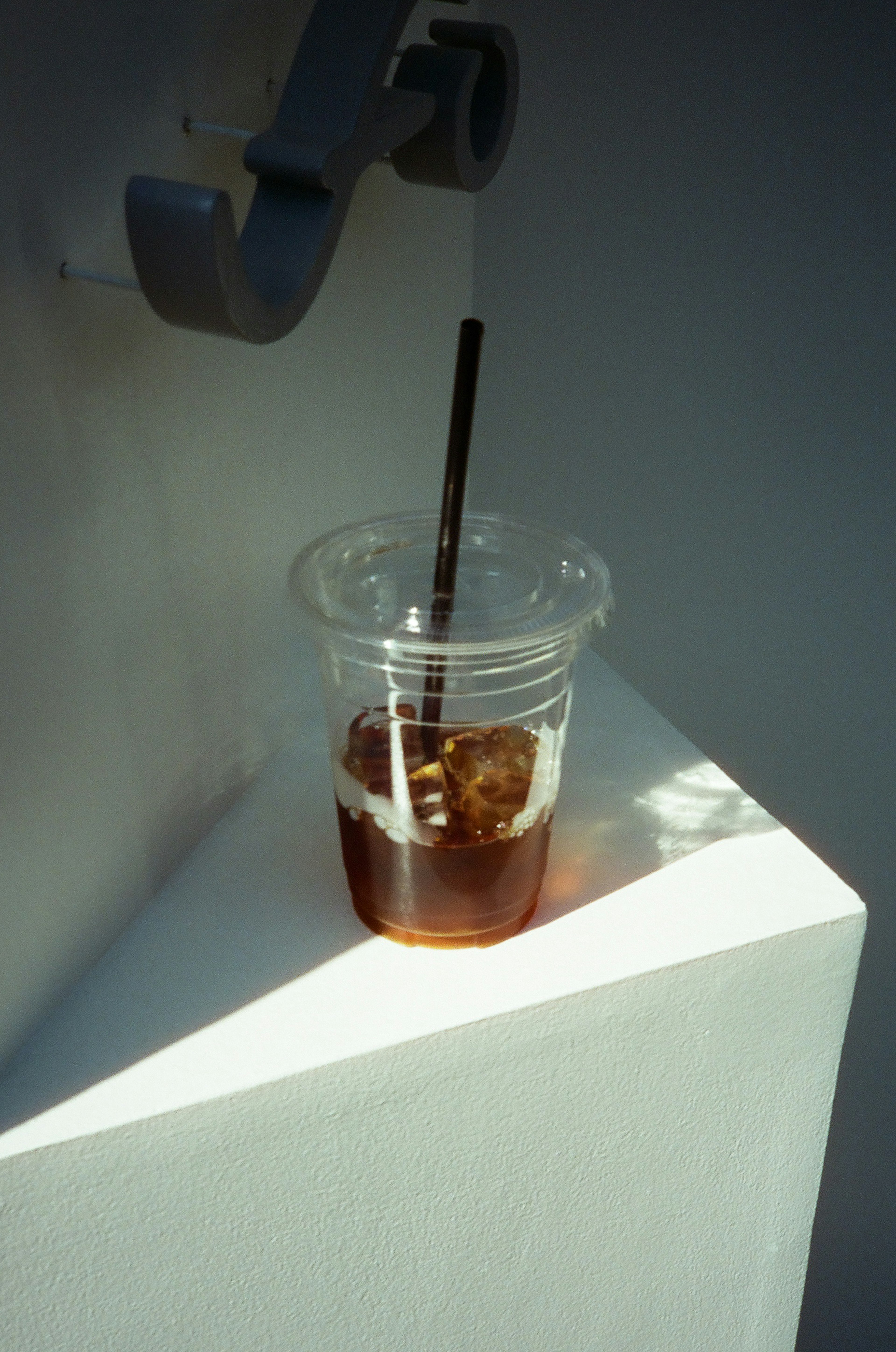 Ice coffee in a clear cup with a straw