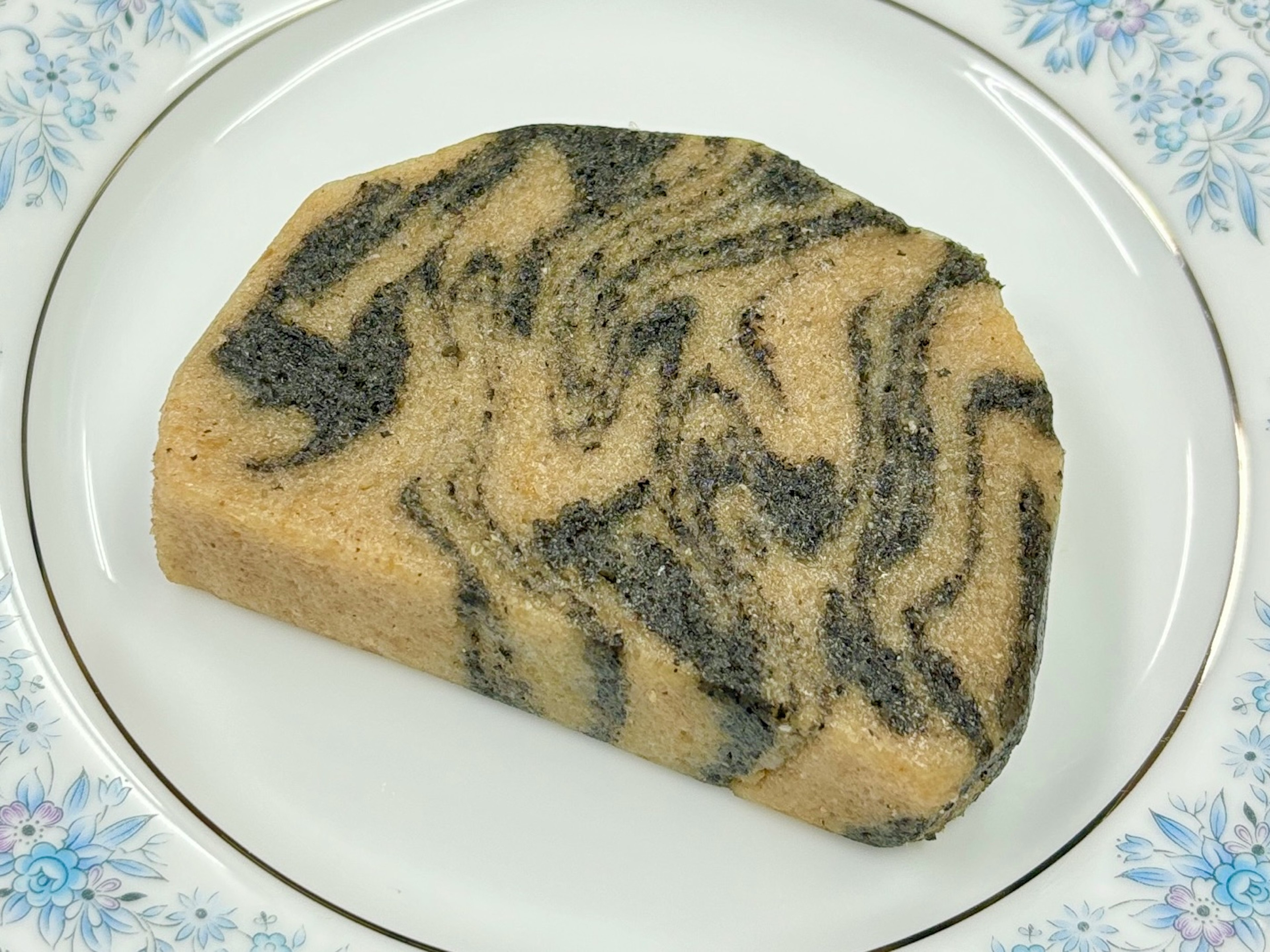 Slice of Japanese confectionery with beautiful black sesame swirl pattern