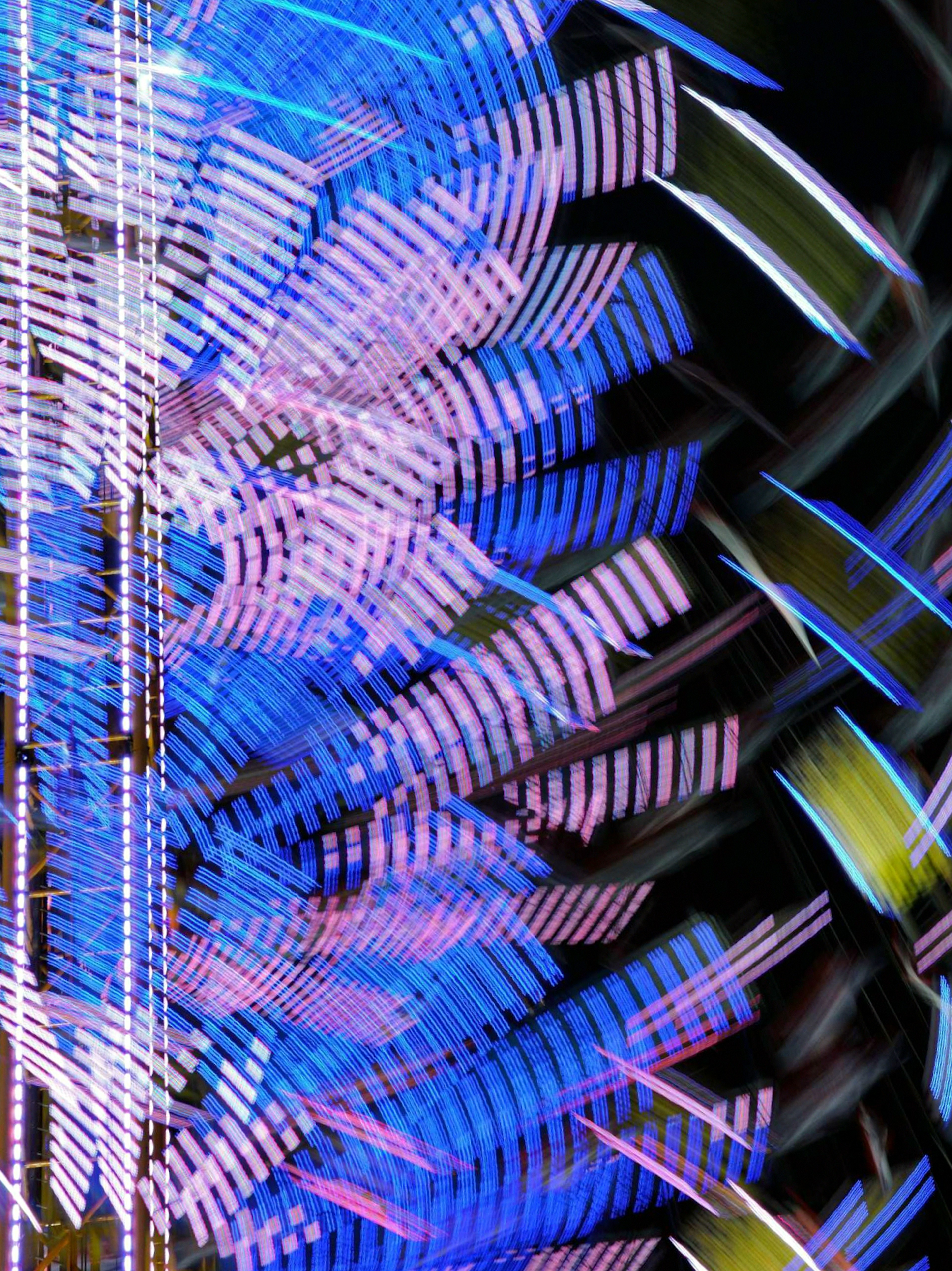 Abstract image featuring vibrant blue and purple light patterns