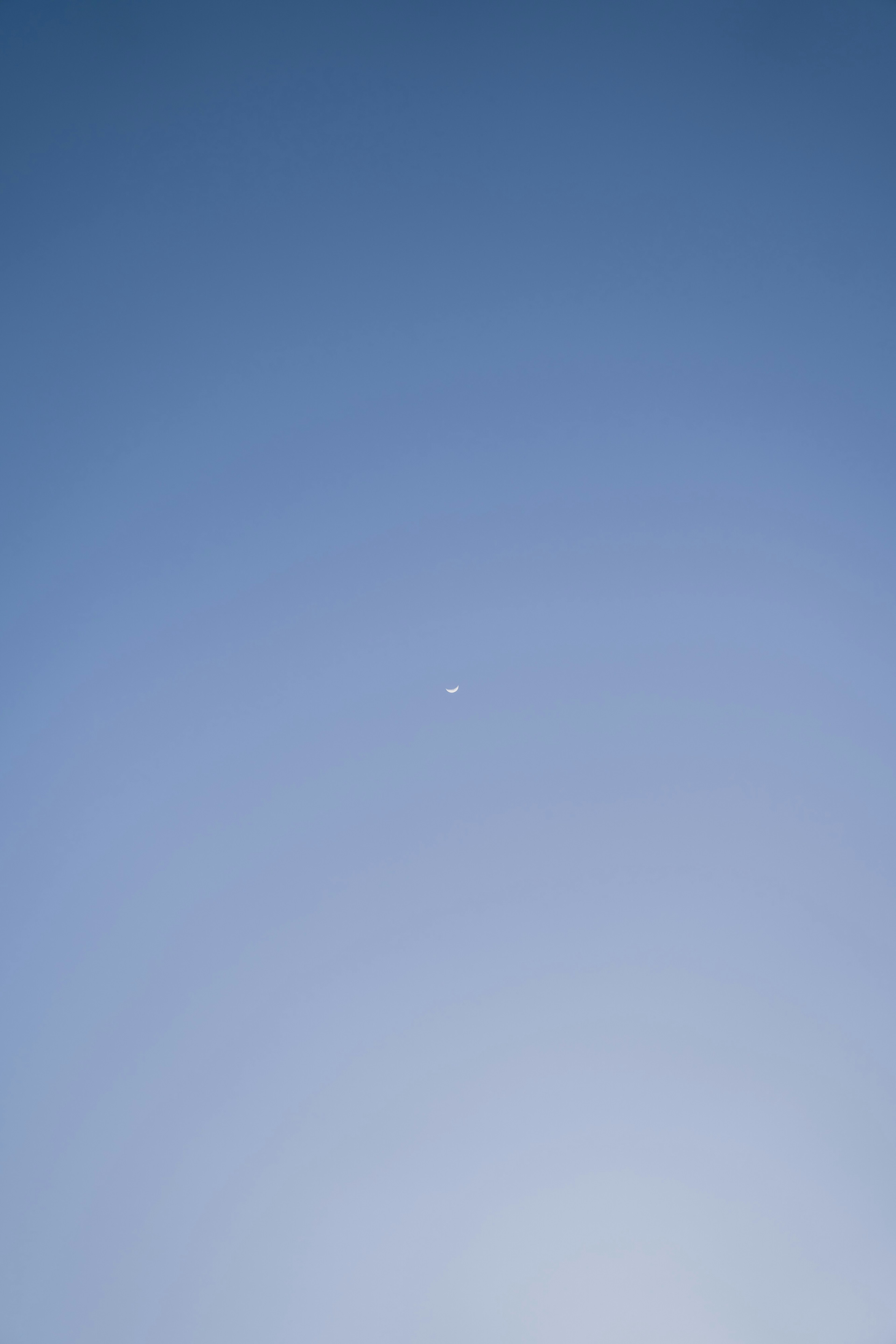 A small airplane in the blue sky