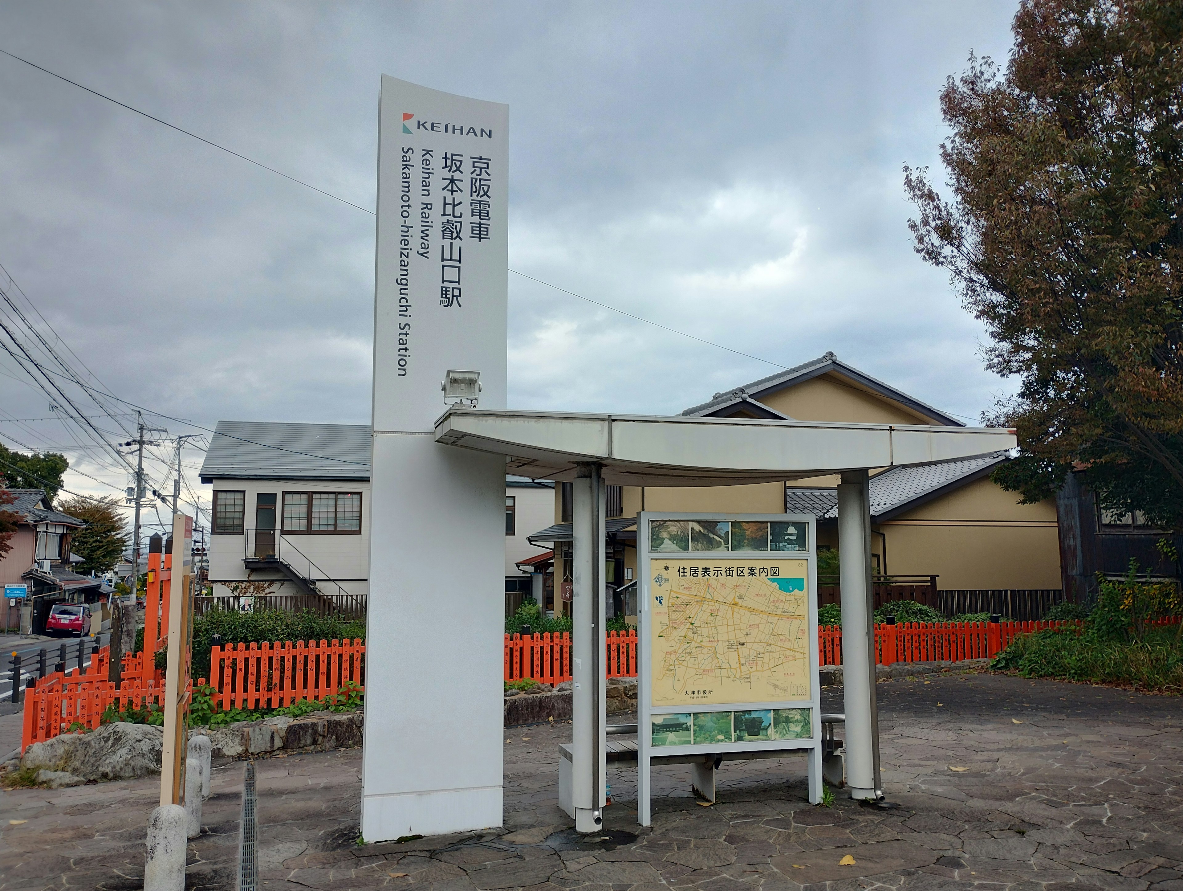 Bus stop sign with surrounding residential area