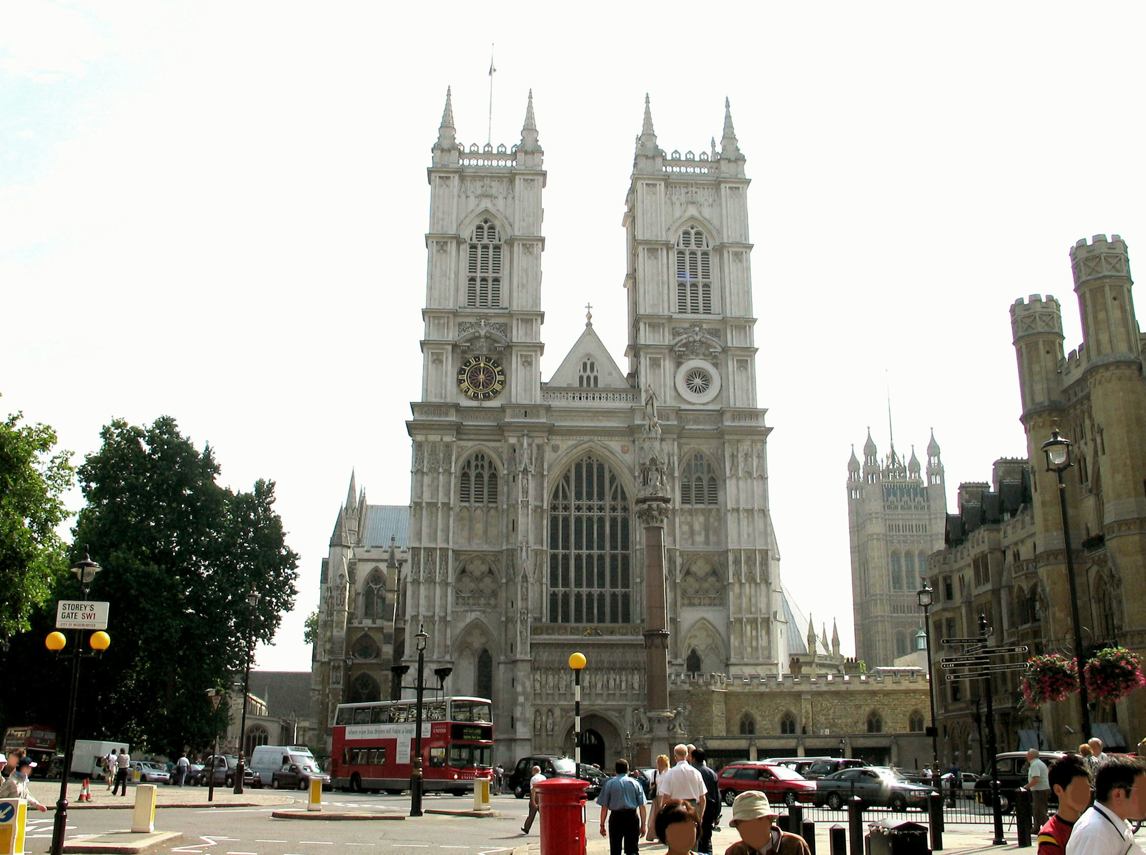 The majestic exterior of Westminster Abbey with surrounding pedestrians