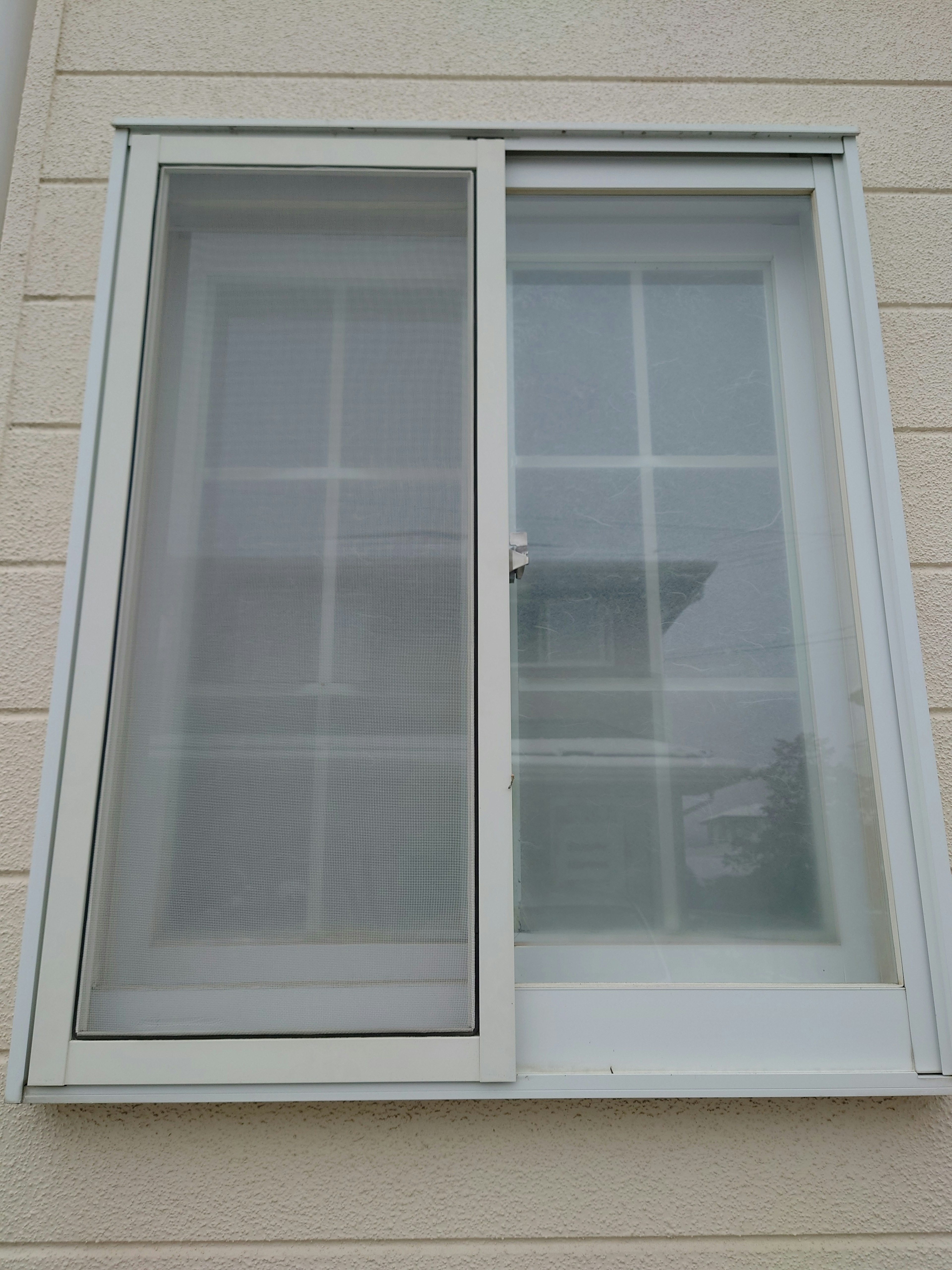 White framed double window with transparent glass